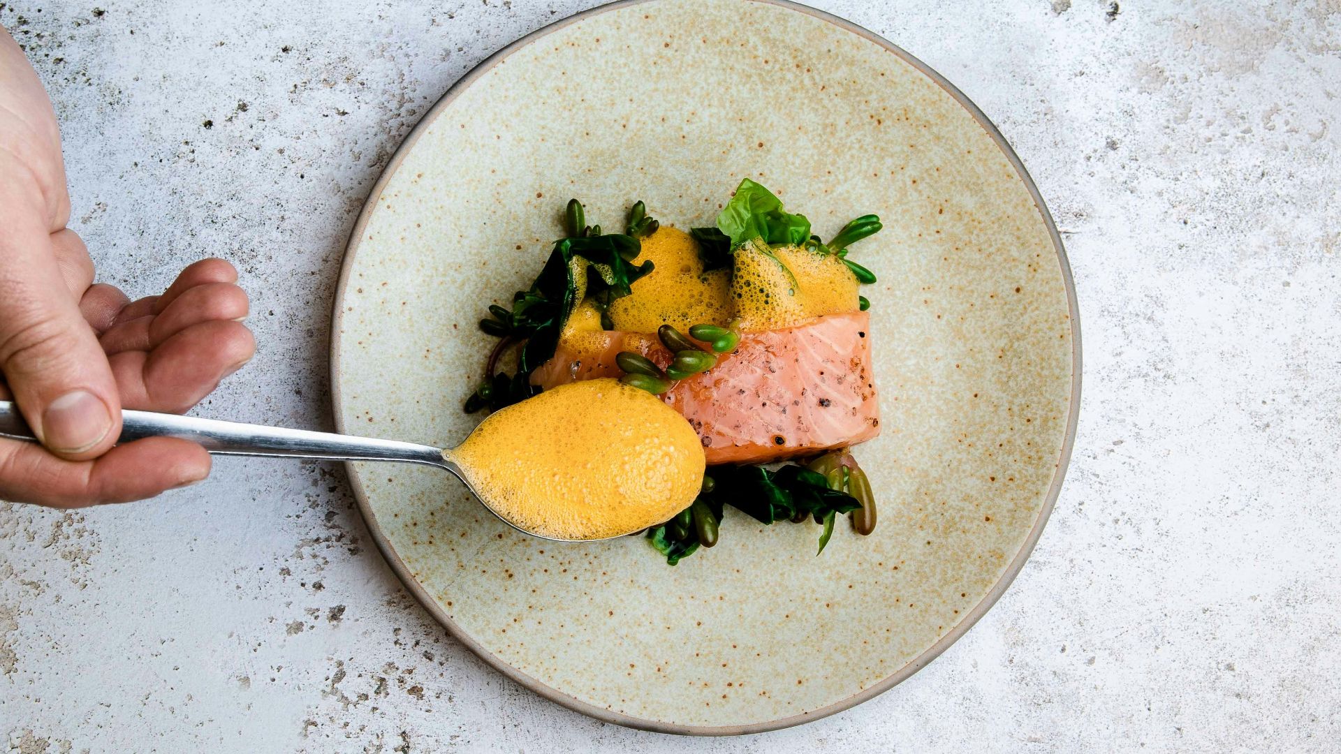 person holding stainless steel fork