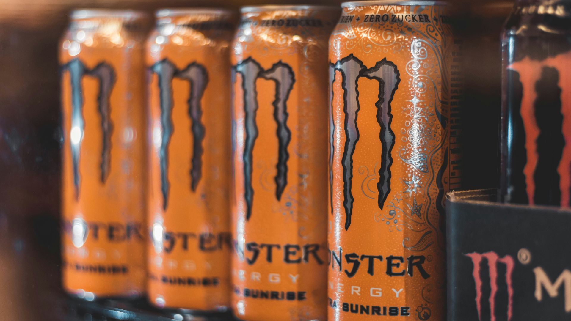 five Monster Energy cans