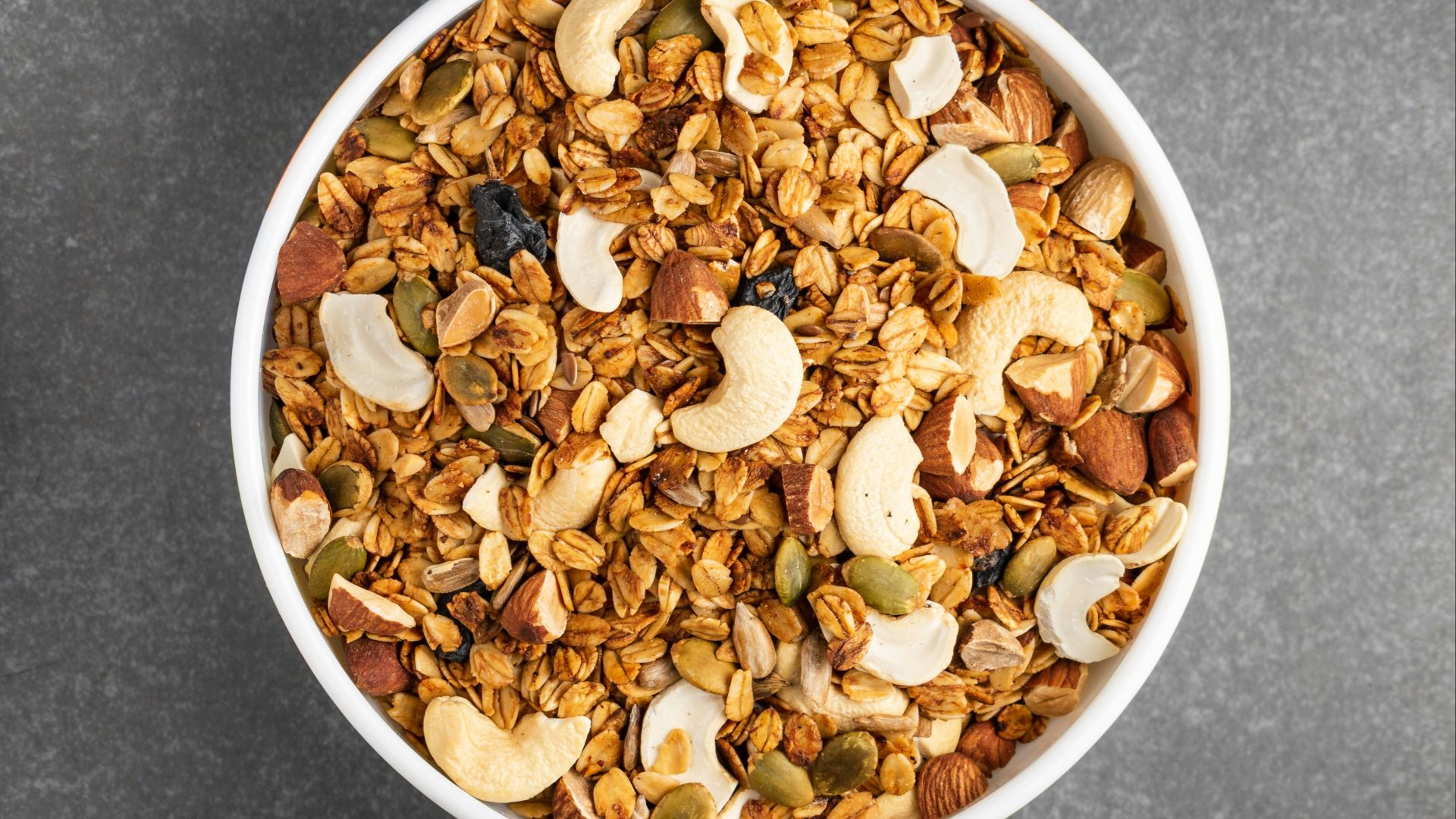 brown peanuts in white ceramic bowl