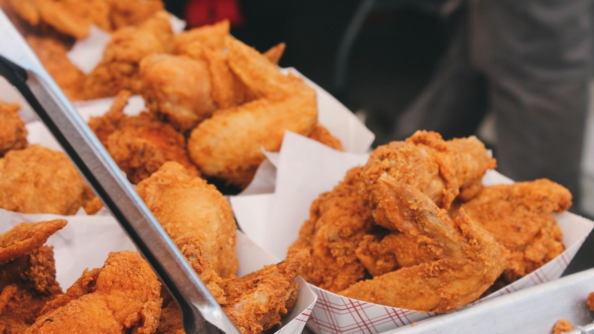 fried chicken on brown paper bag
