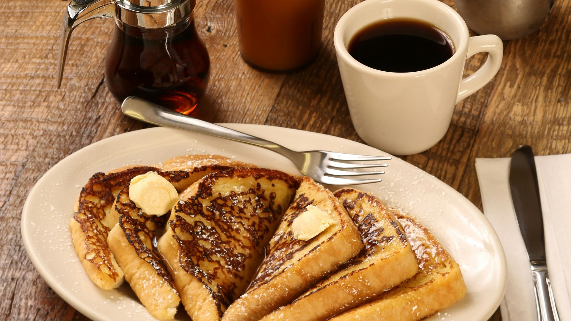 food photography of strawberries, oranges, and pancakes on plates
