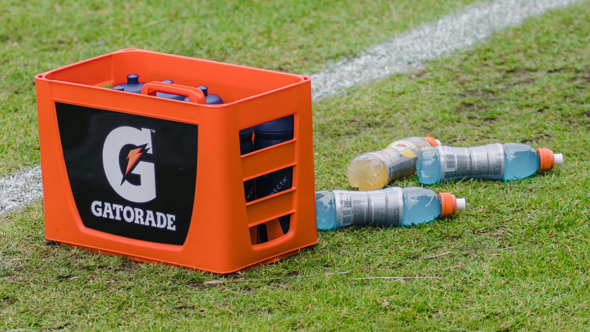 an orange box sitting on top of a soccer field