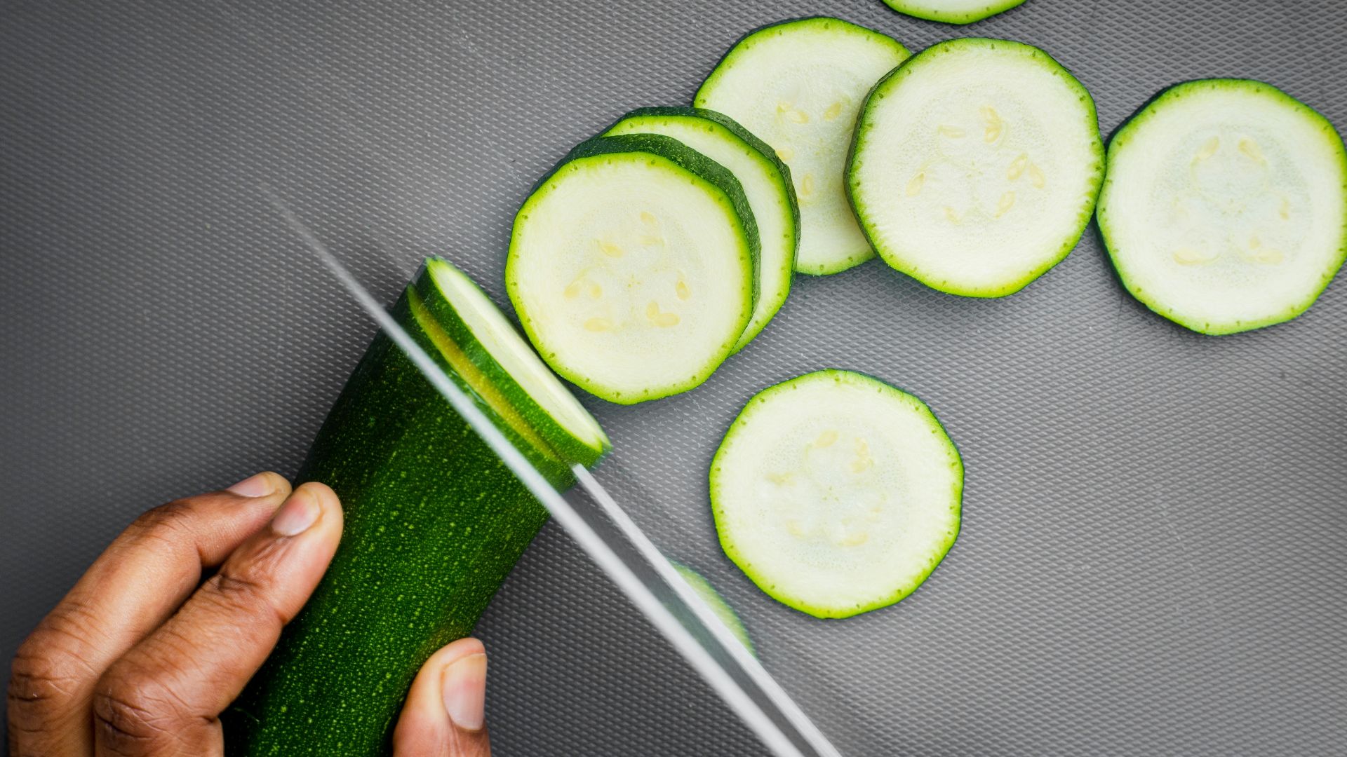 sliced cucumber on black textile