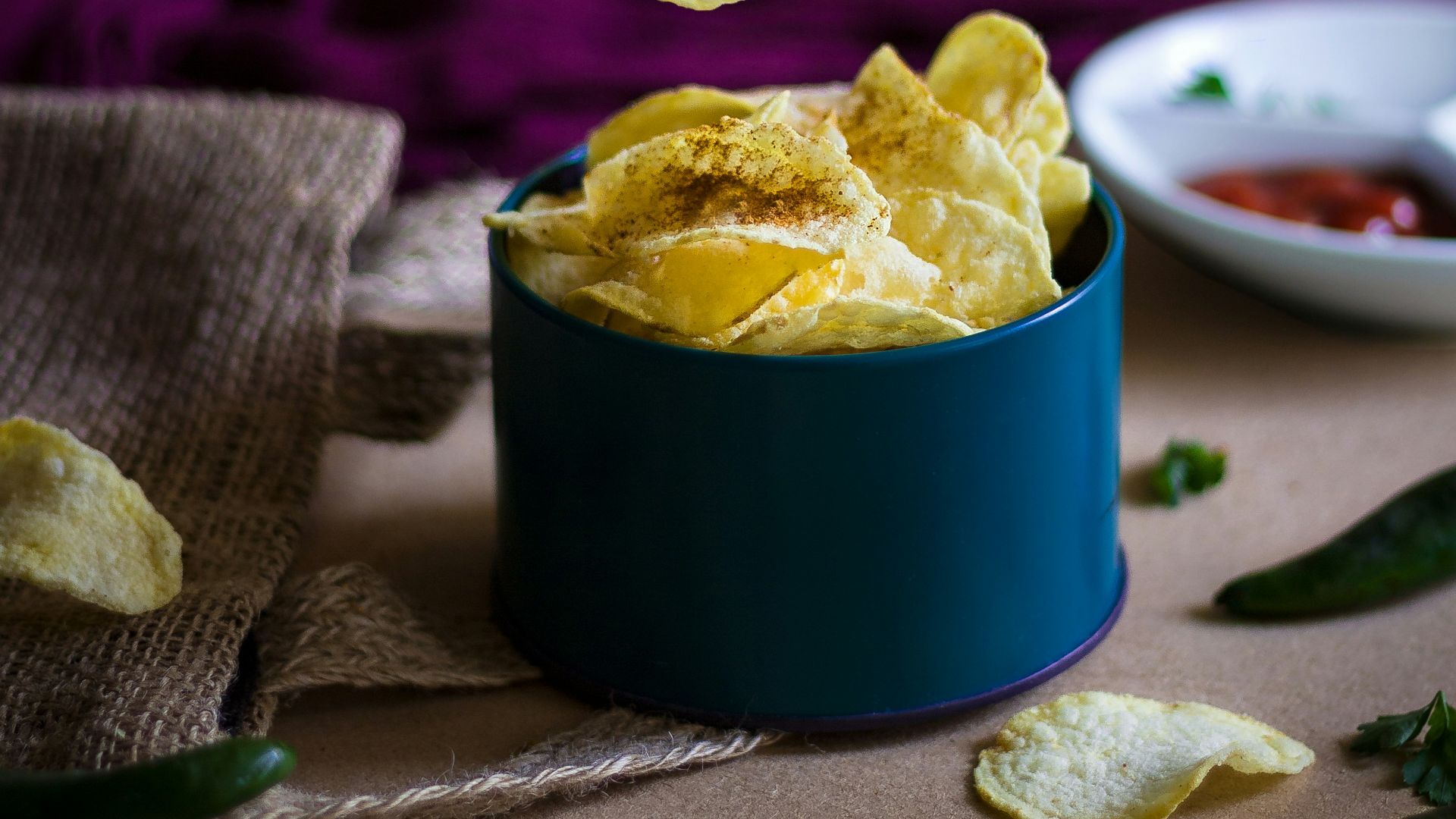 blue ceramic mug on green table cloth