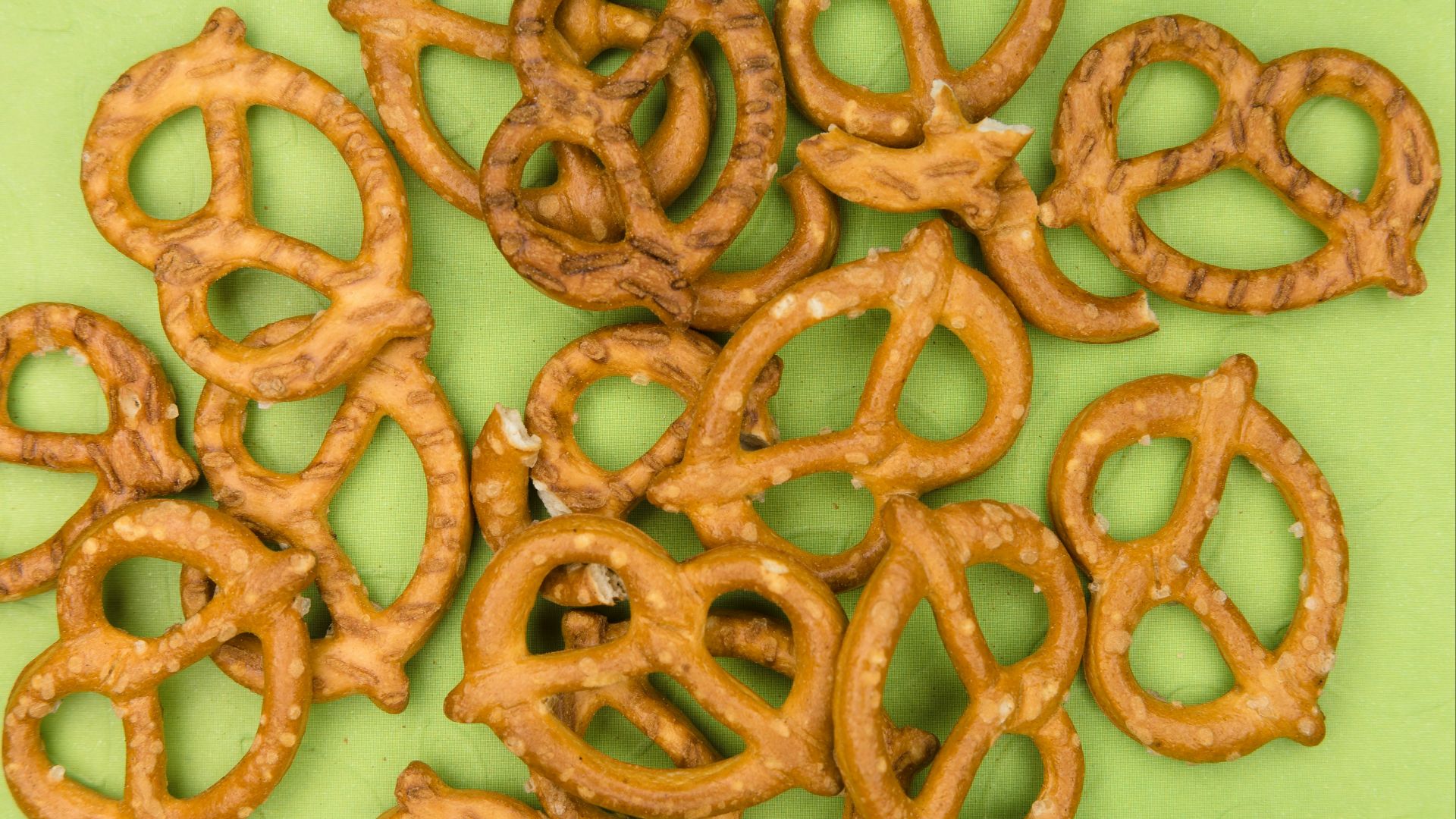 brown cookies on white and green floral ceramic plate