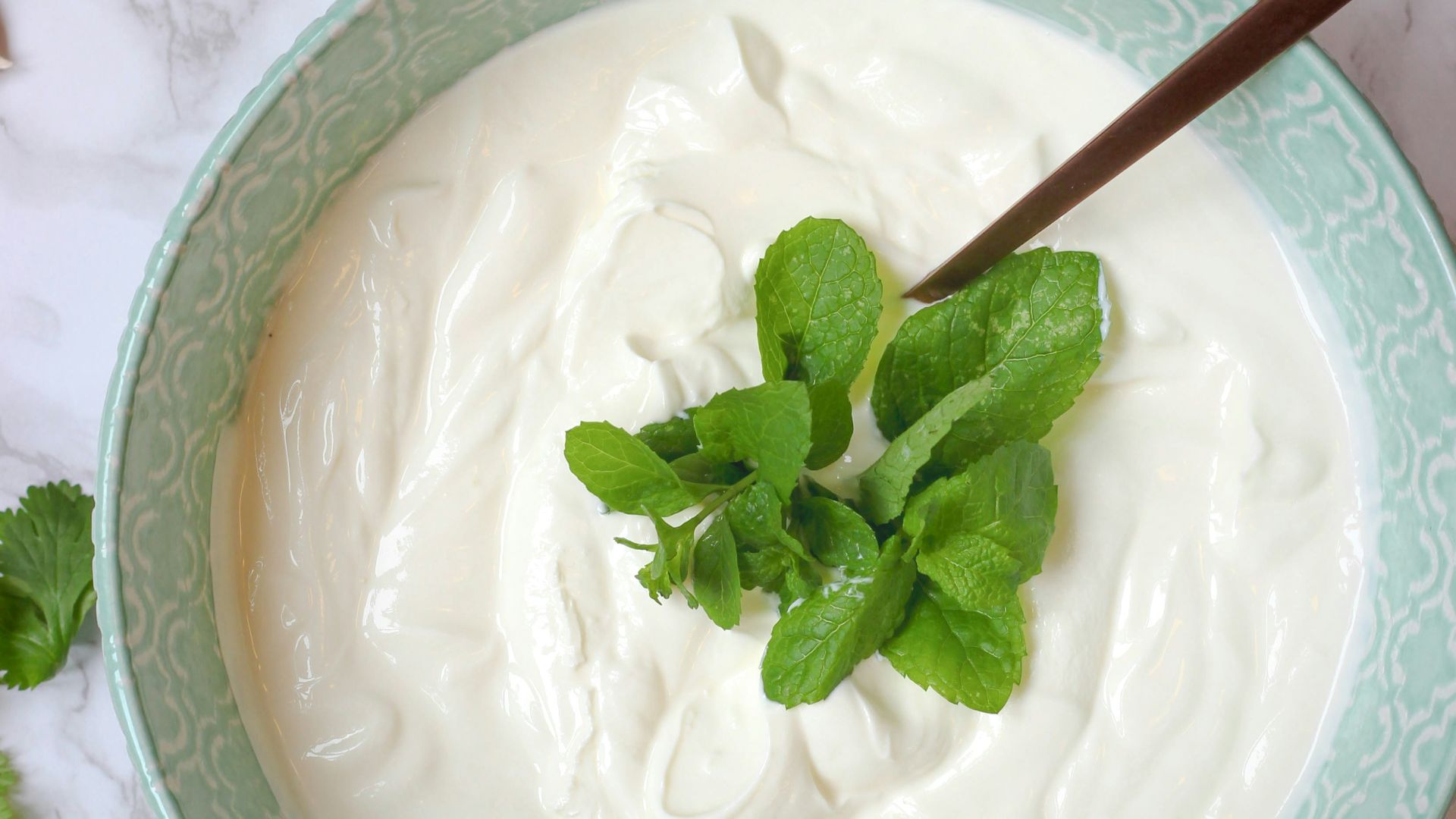 a bowl of yogurt with a spoon in it
