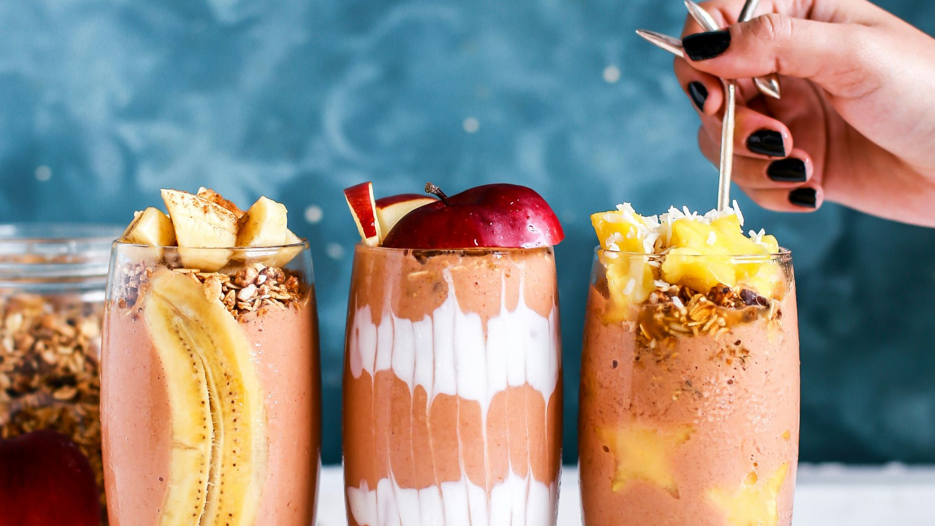 three clear drinking glass filled by shakes