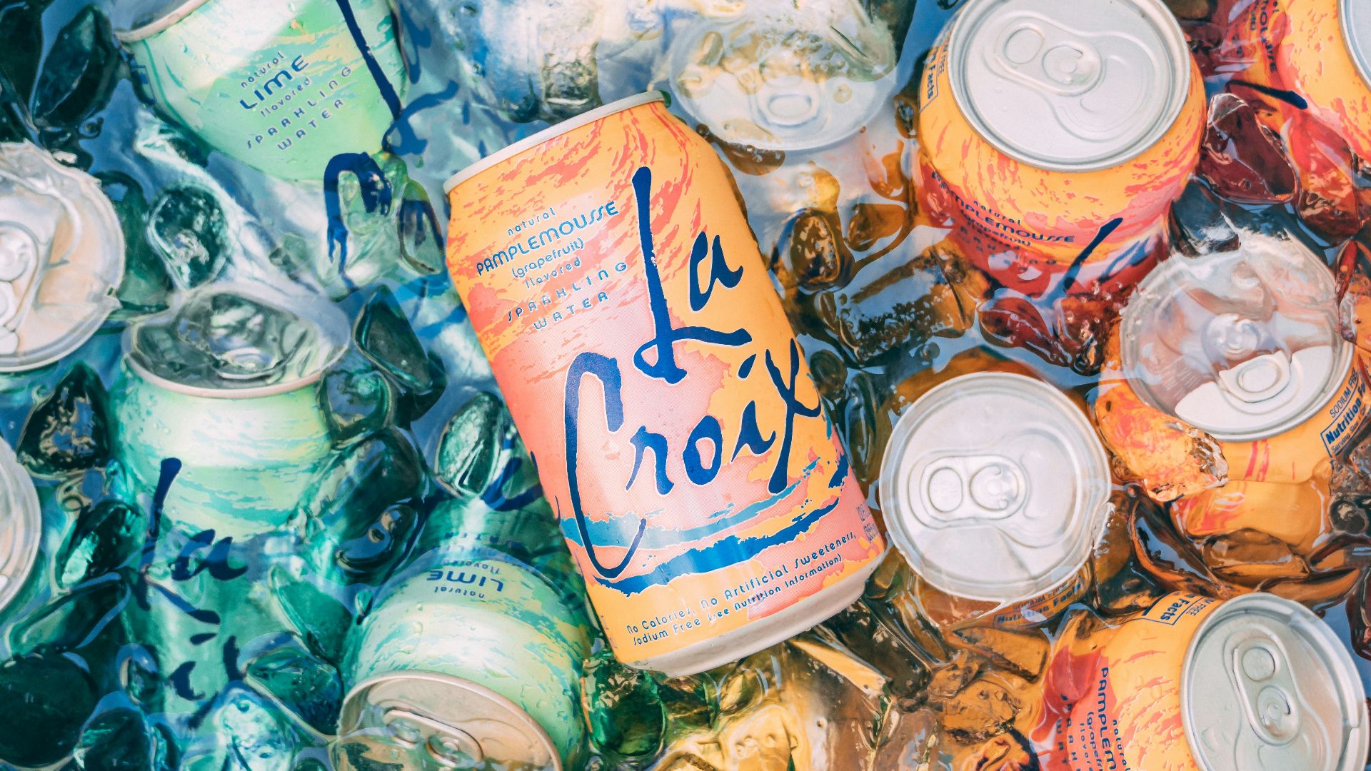 top view photography of orange steel soda can lot