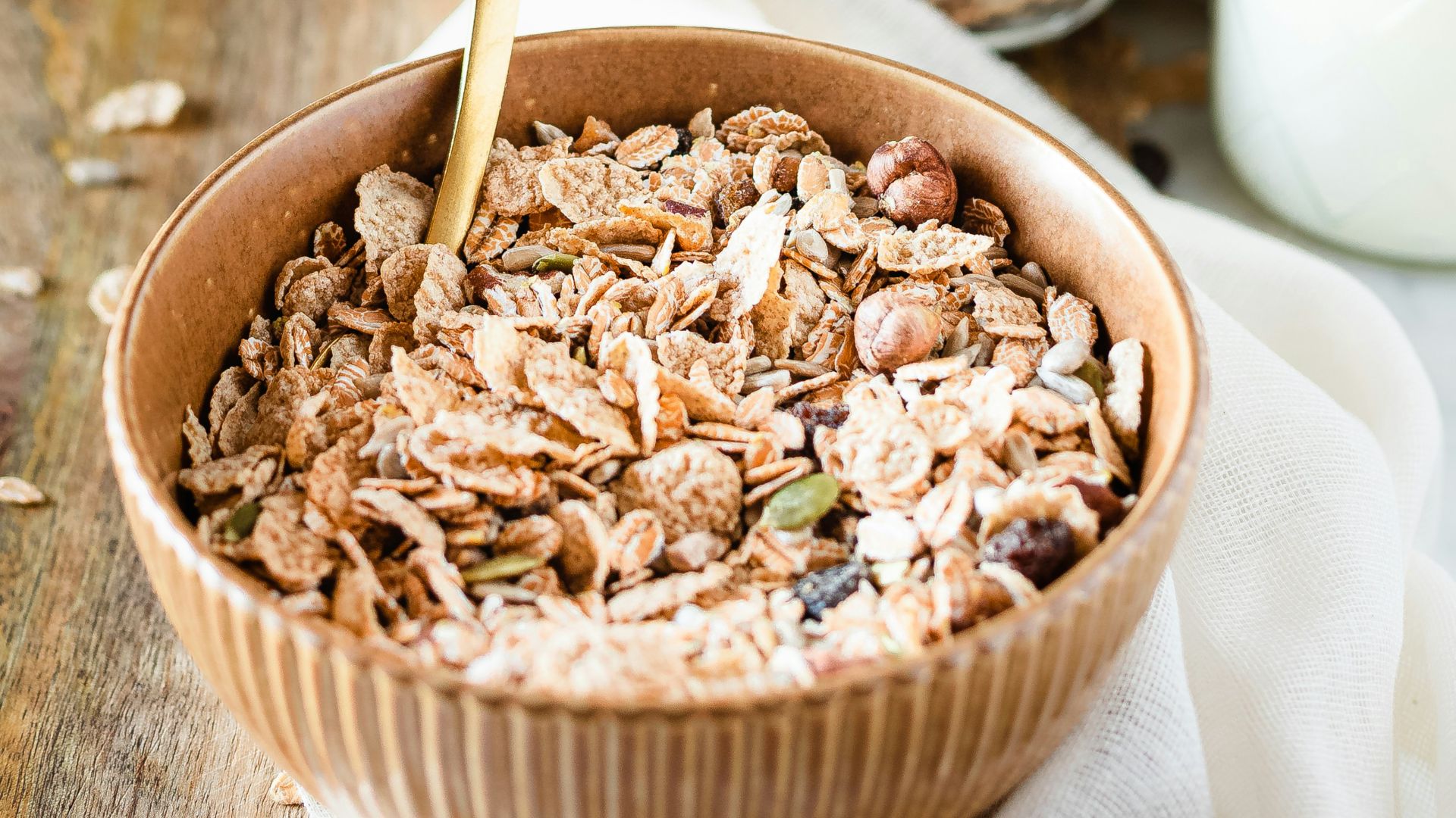 brown wooden bowl with brown wooden spoon