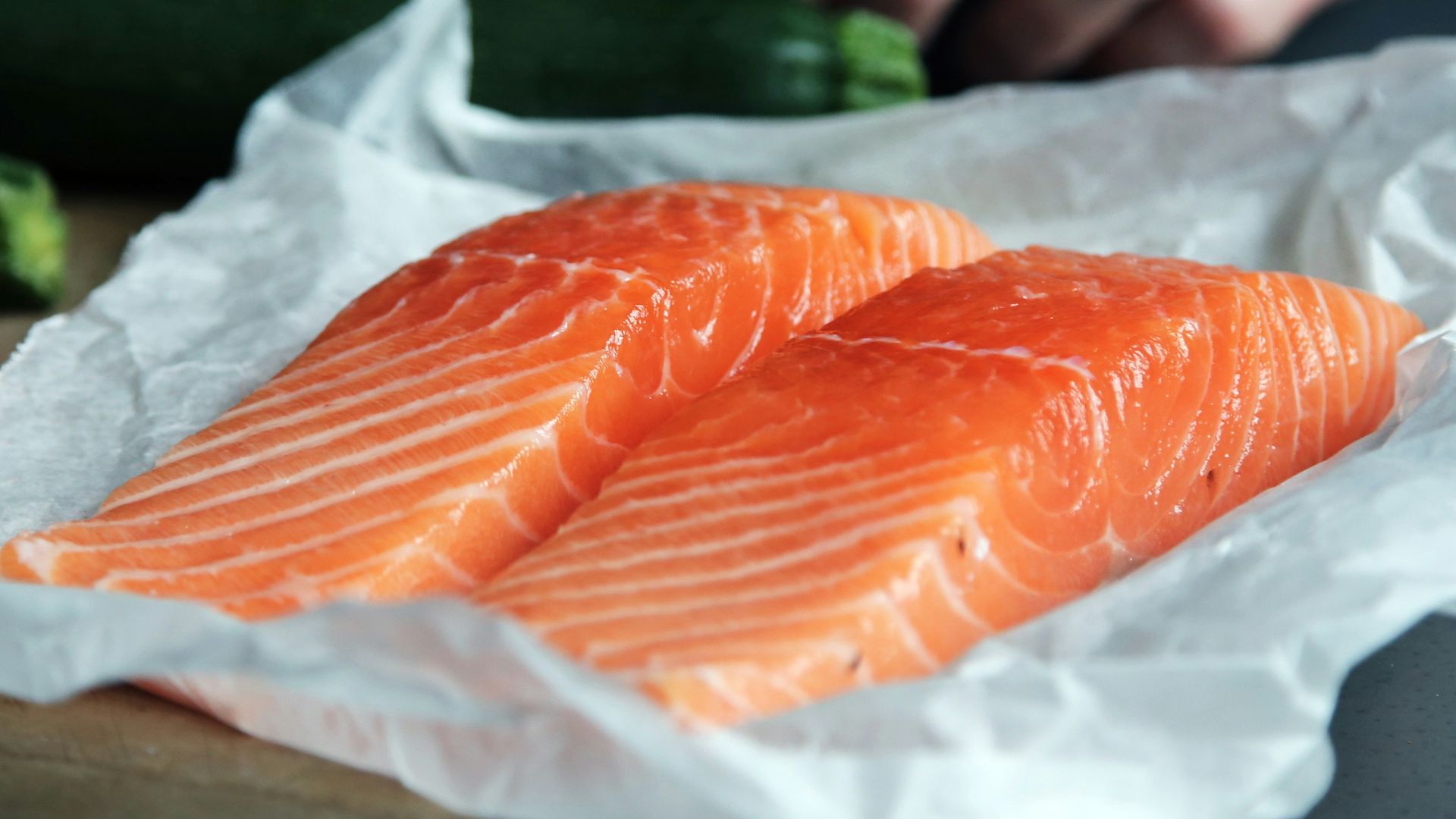 raw fish meat on brown chopping board