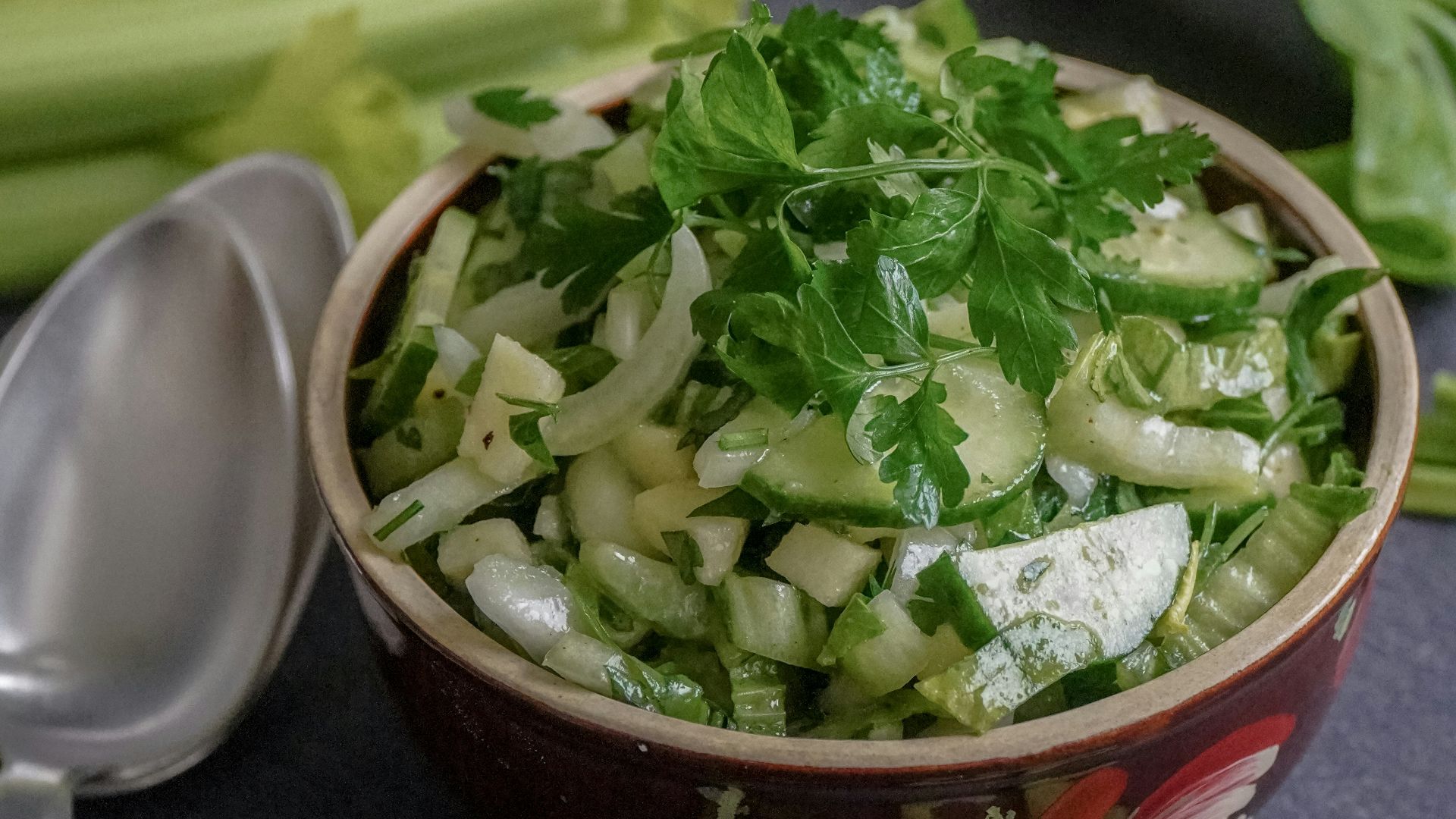 green vegetable on red ceramic bowl