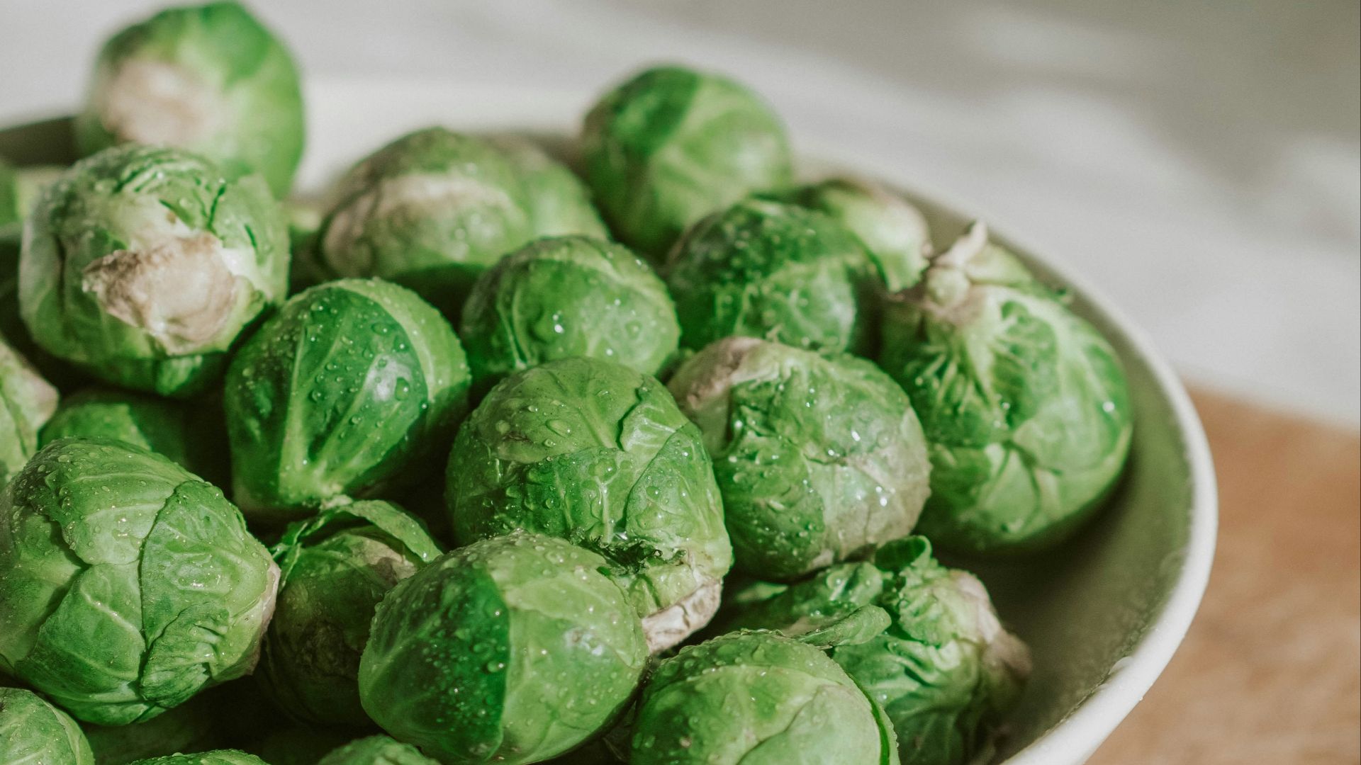 green vegetable on white ceramic bowl