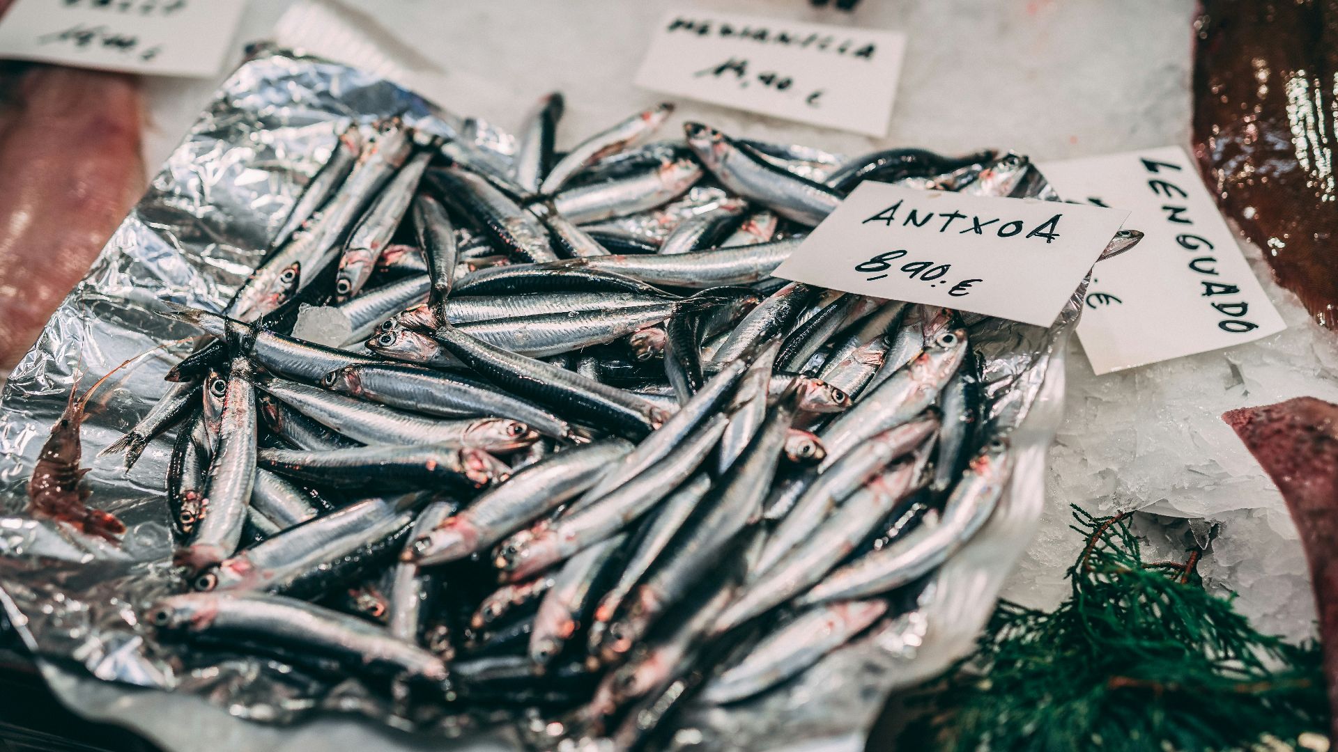 raw fish on white textile