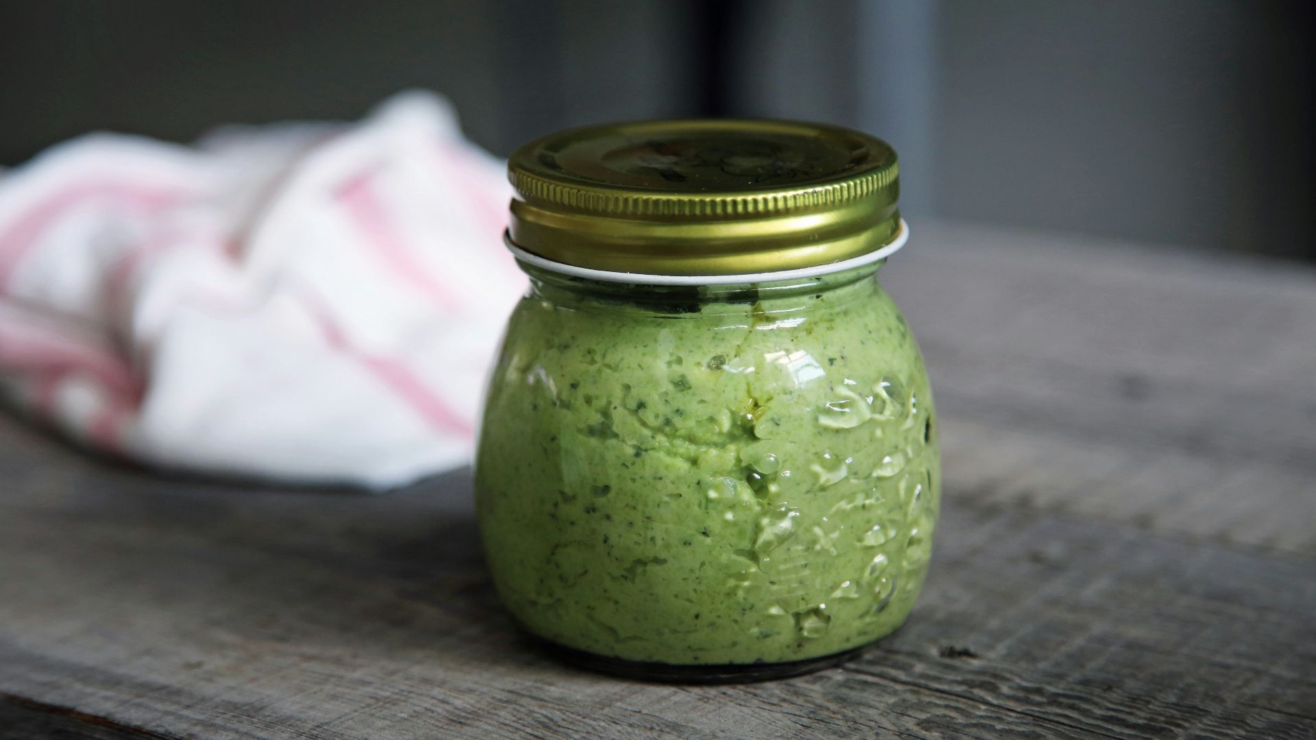 clear glass jar on gray surface