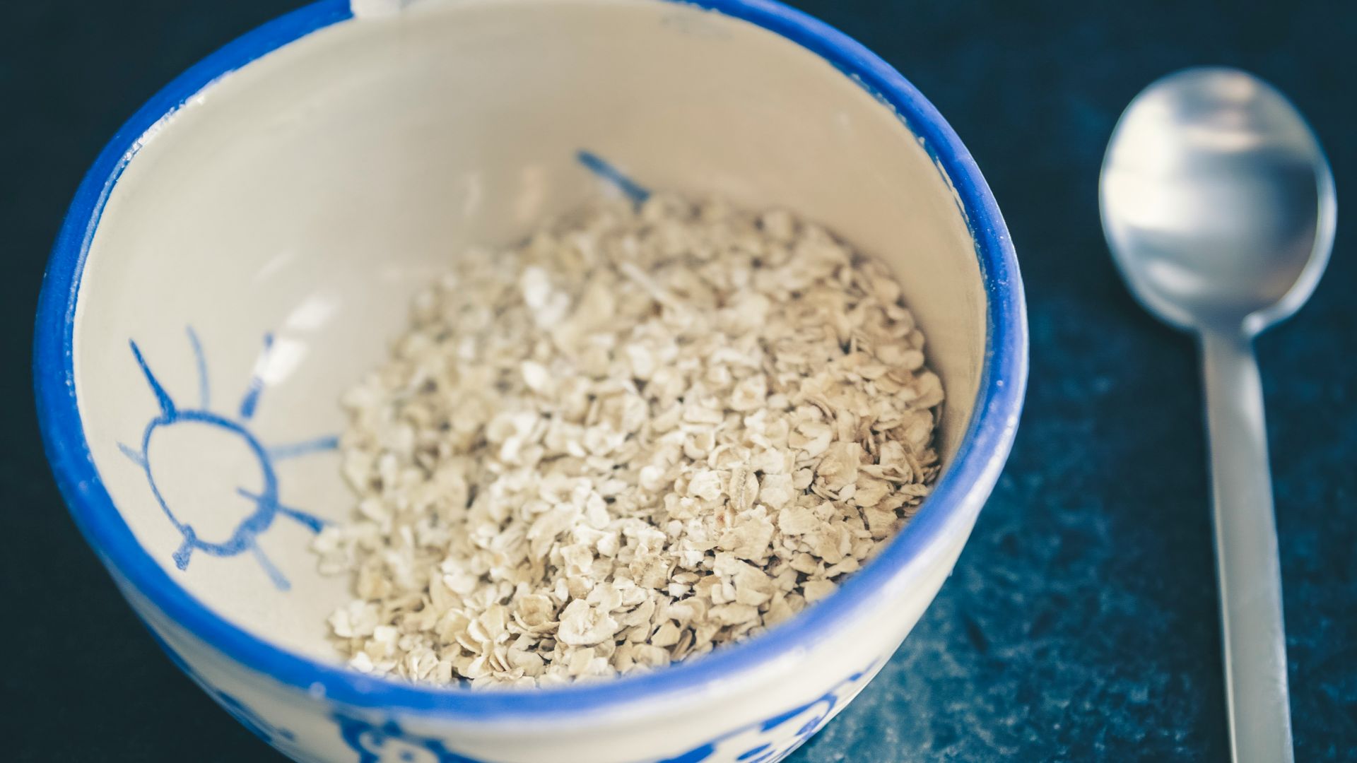 cereals in blue and white ceramic bowl