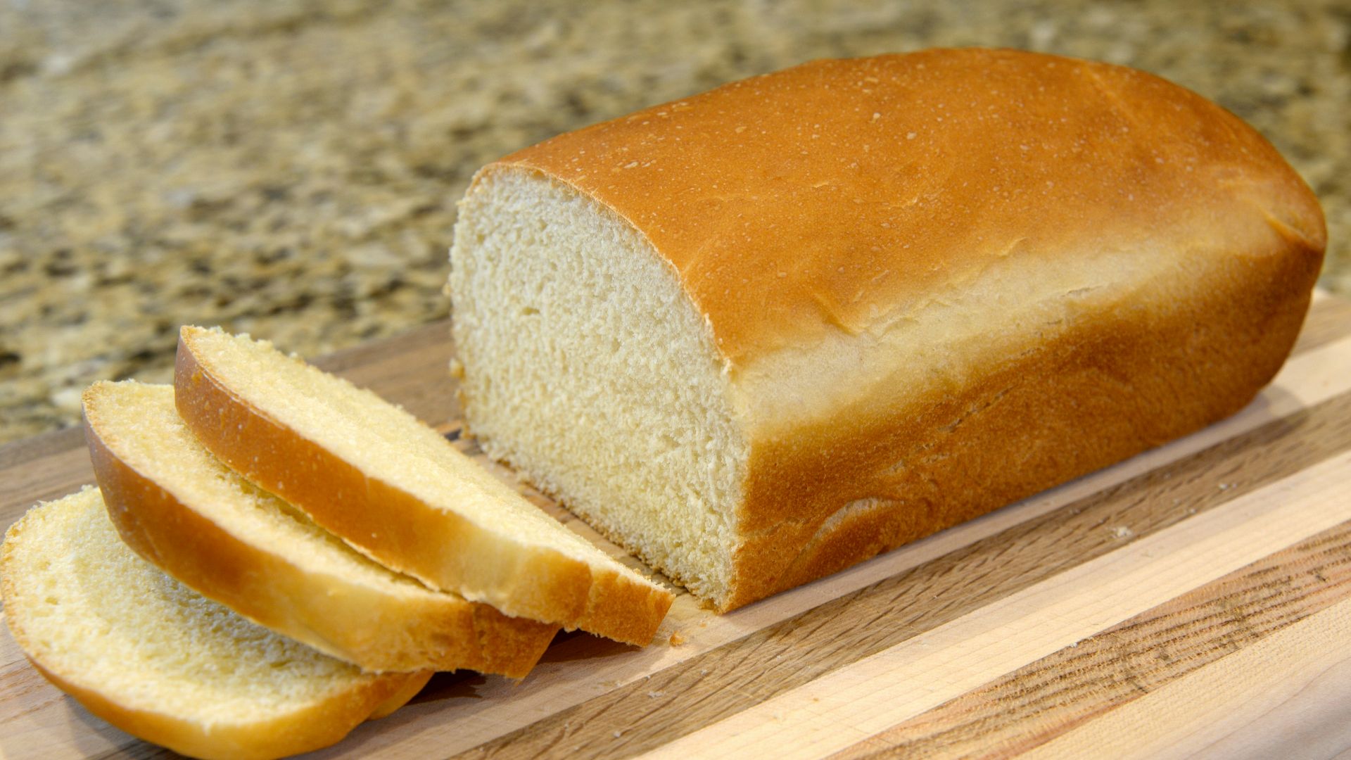 bread on brown wooden chopping board