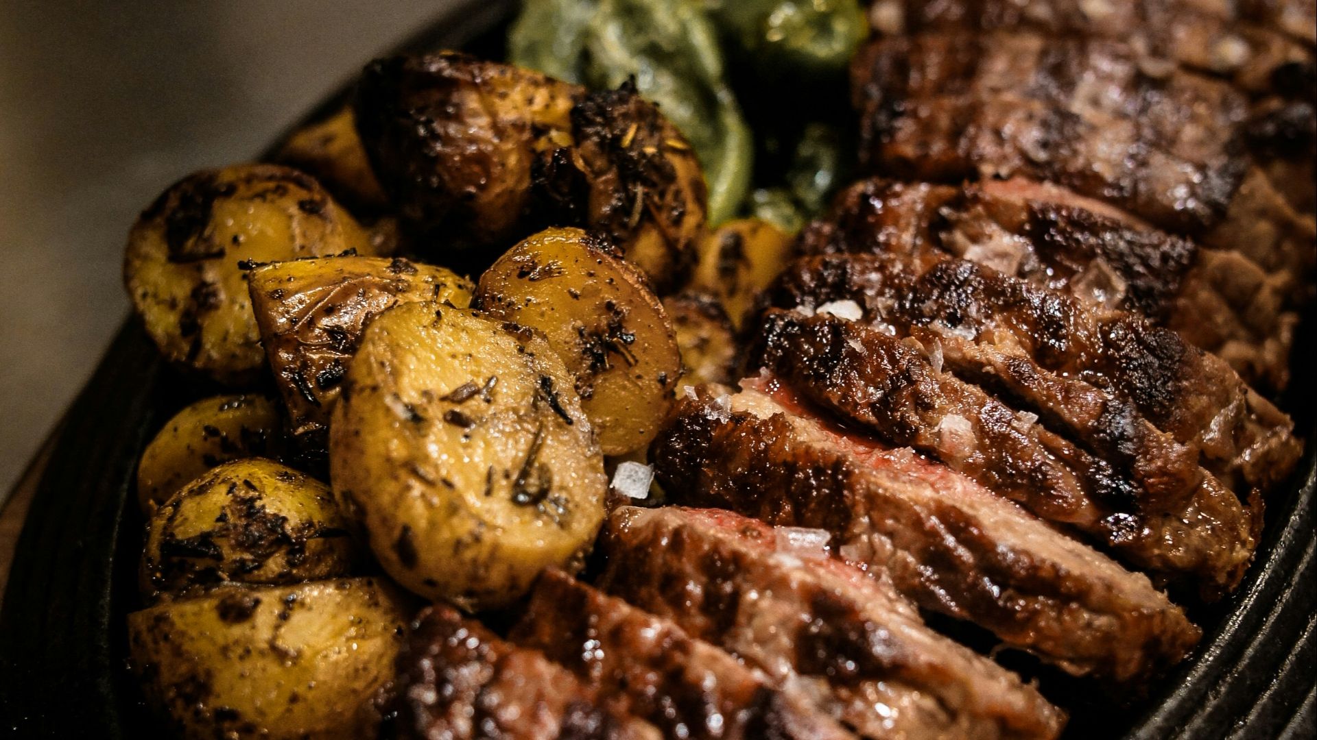 grilled meat on black ceramic plate