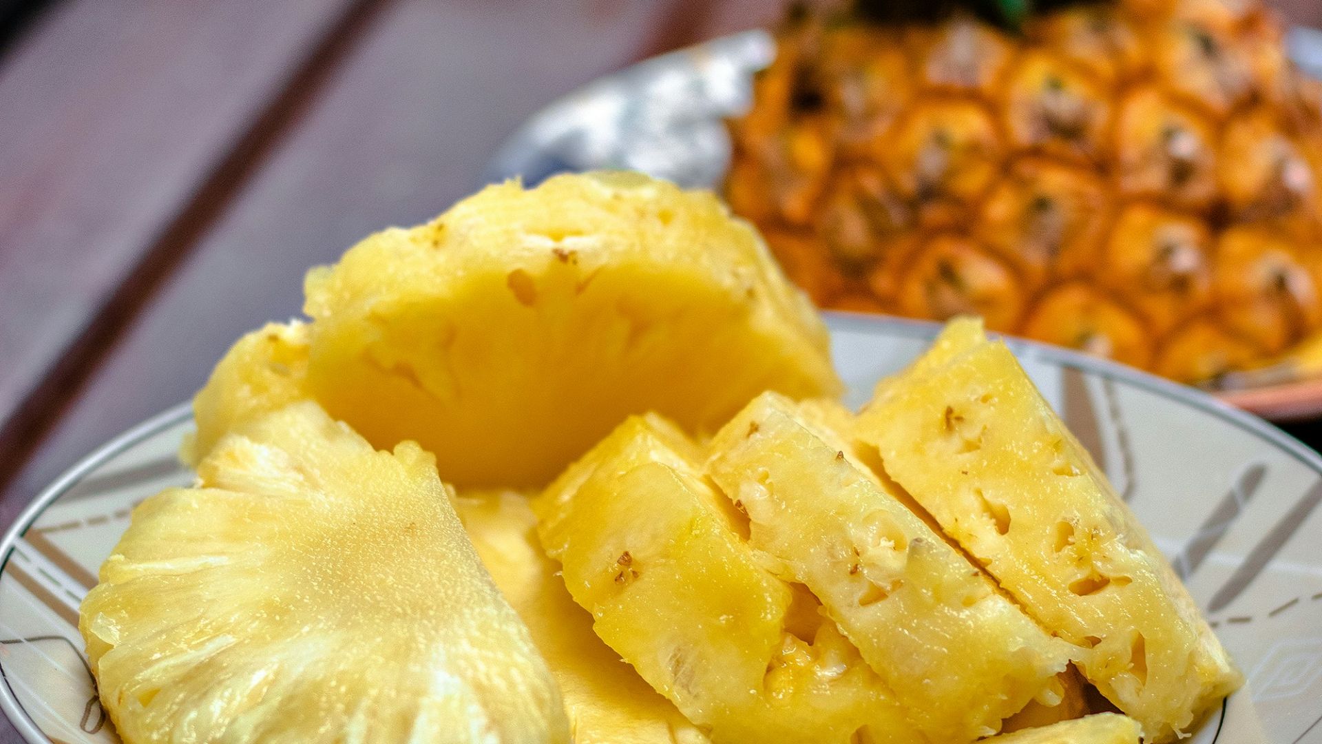 sliced pineapple on white ceramic plate
