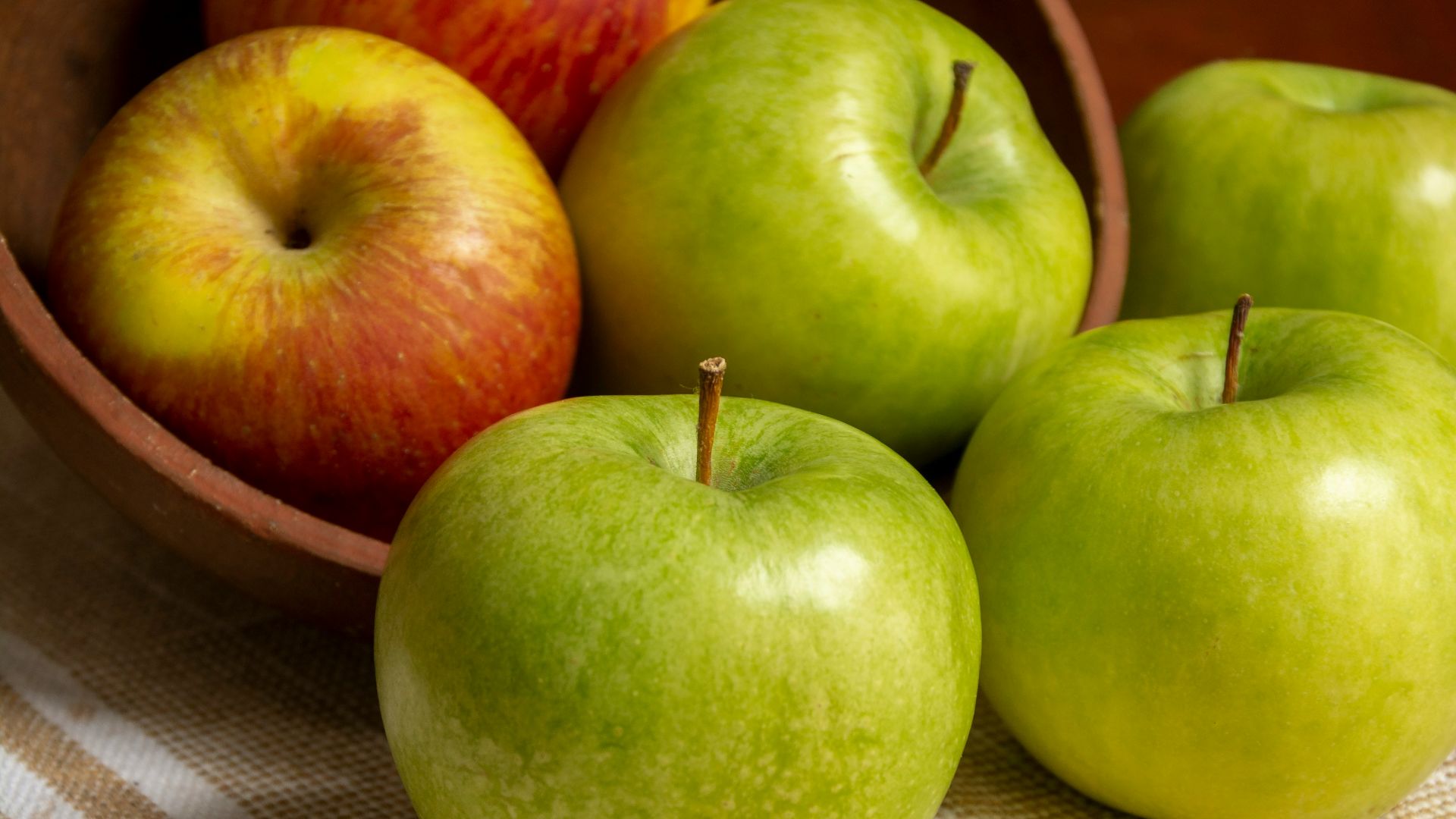green apple on white table cloth