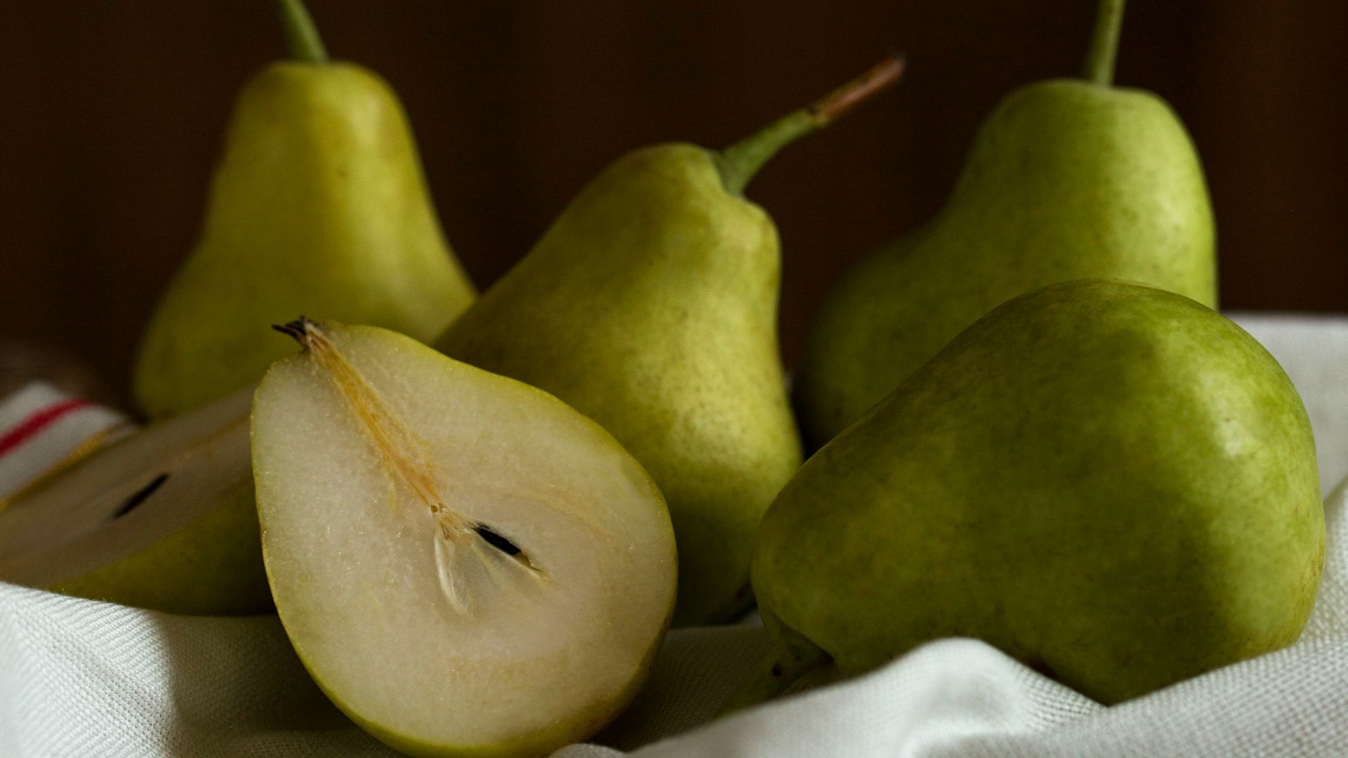green apple fruit on white textile