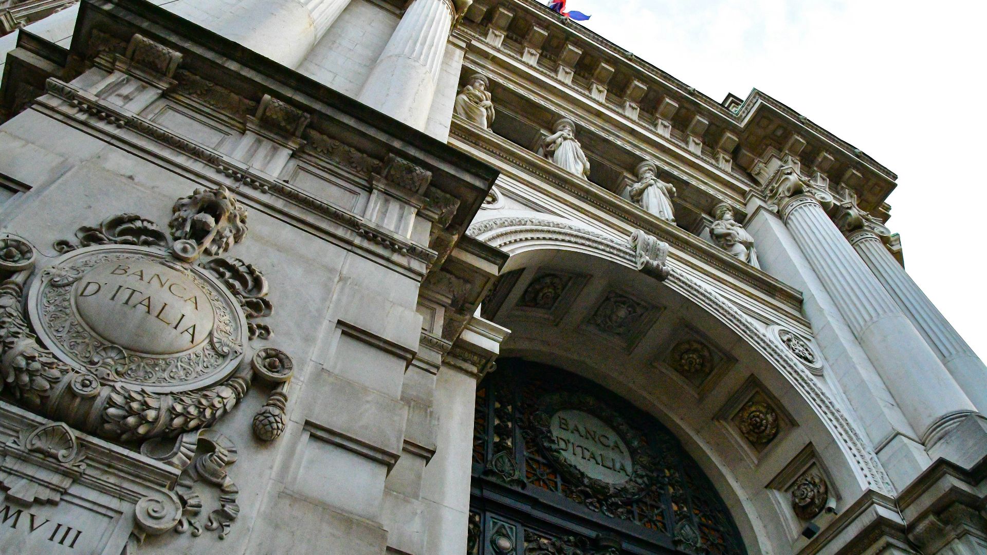 a tall building with a clock on the front of it