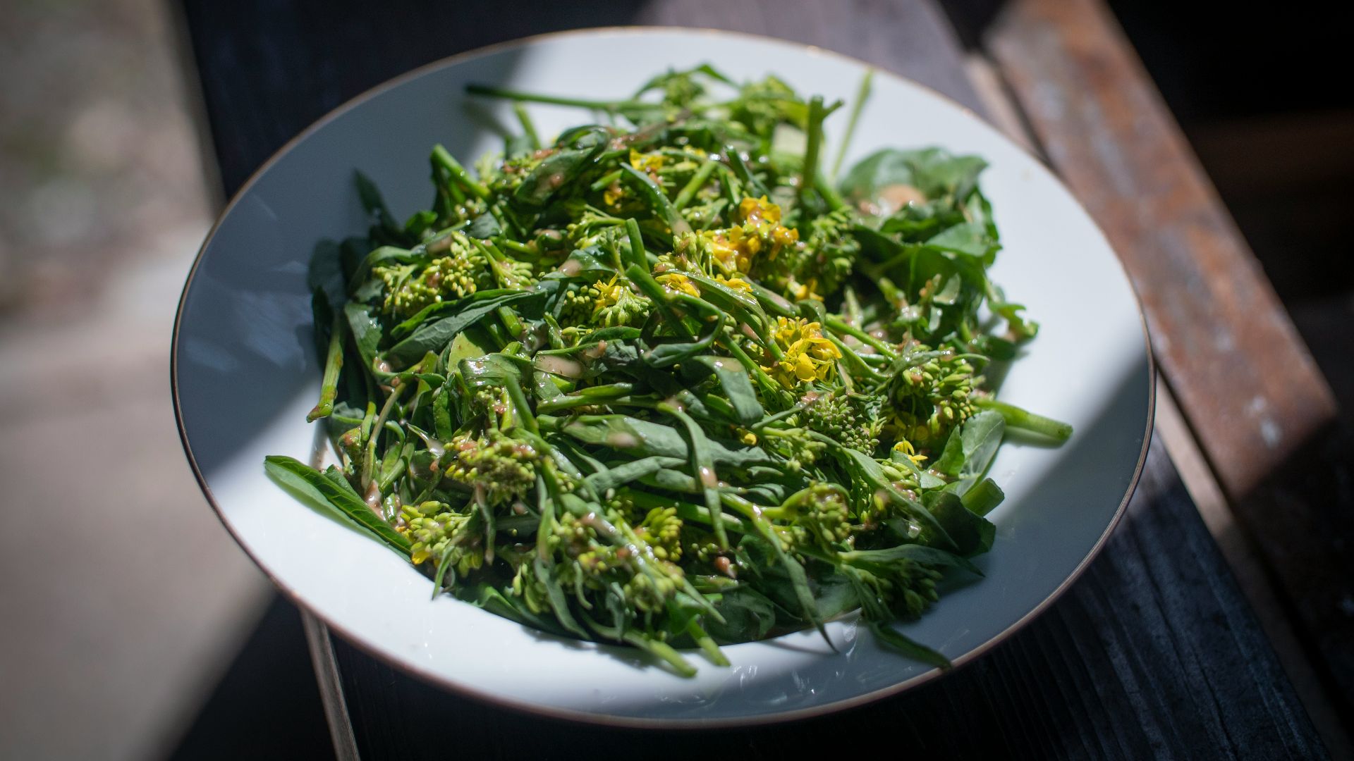 green vegetable on white ceramic plate