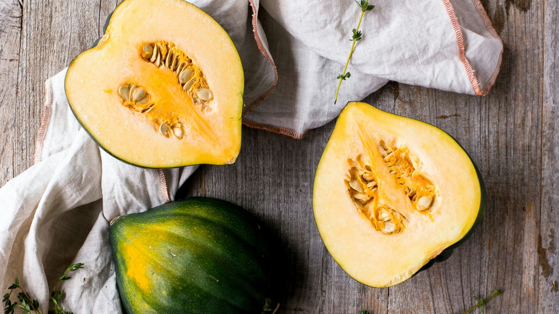 green and yellow squash on brown surface