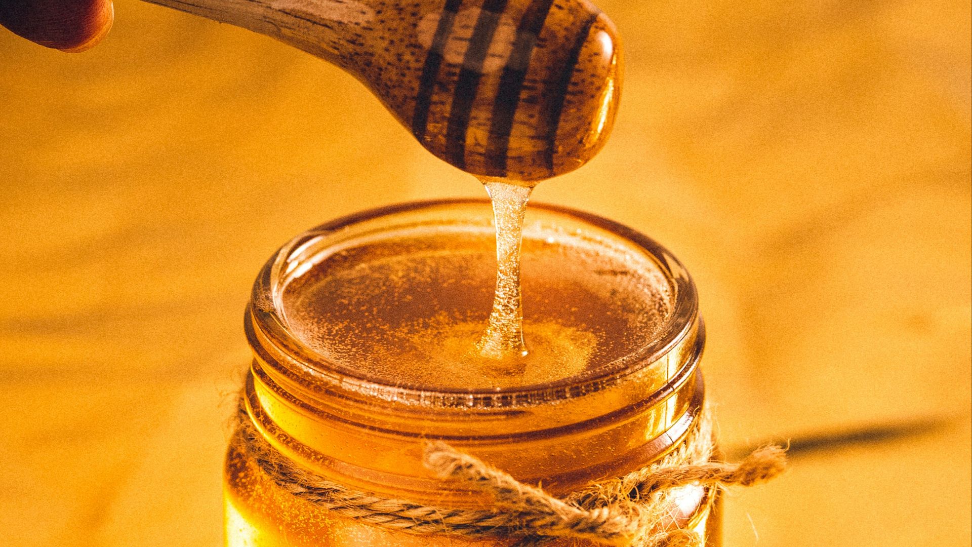 clear glass jar with brown liquid