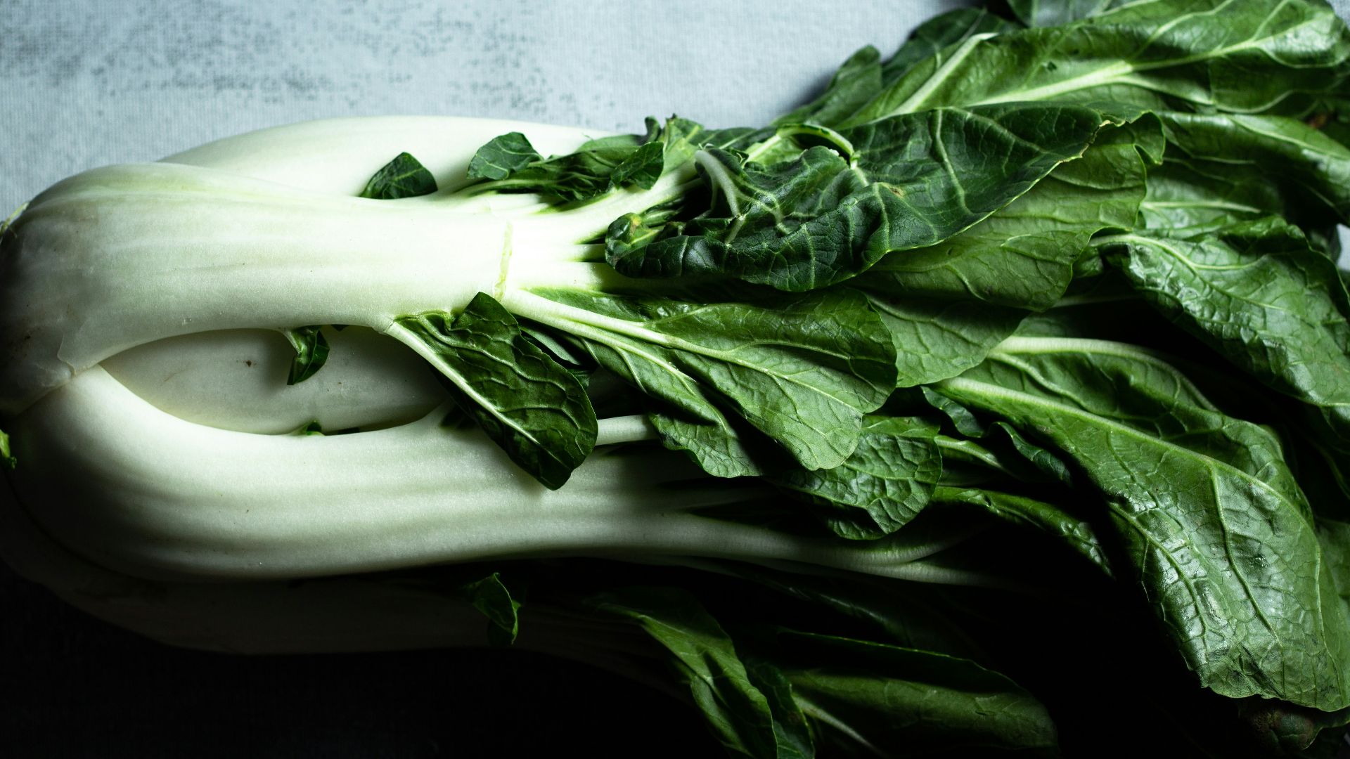 green vegetable on white ceramic plate