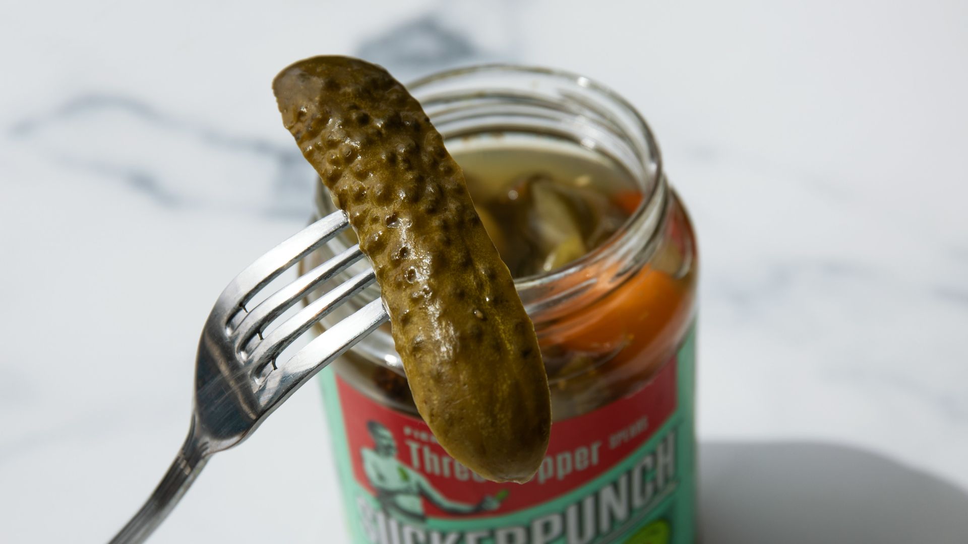 stainless steel fork on green labeled can