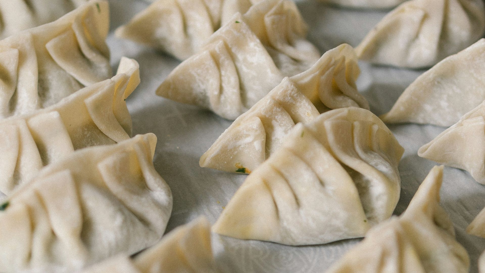 white textile on brown wooden table