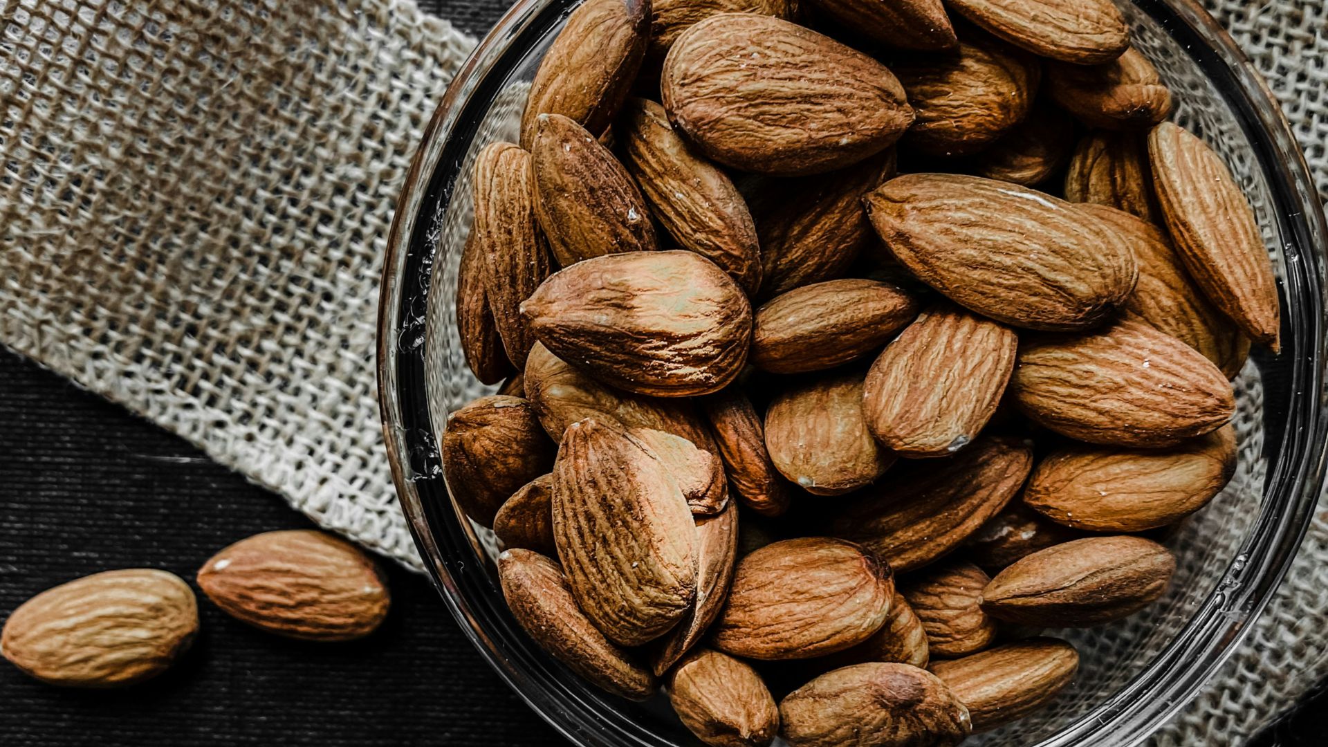brown almond nuts on stainless steel bowl