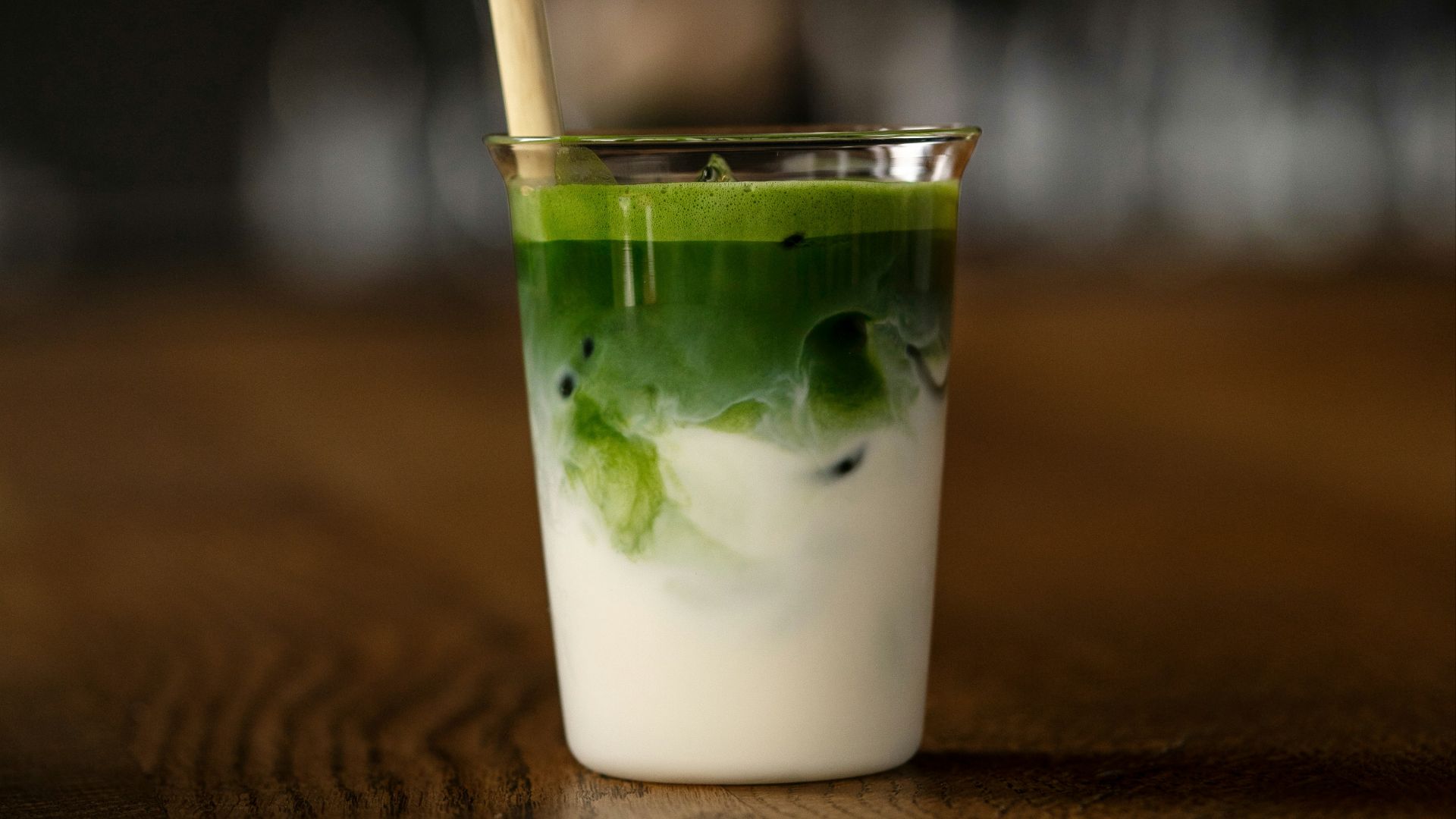 a drink with a straw in it sitting on a table