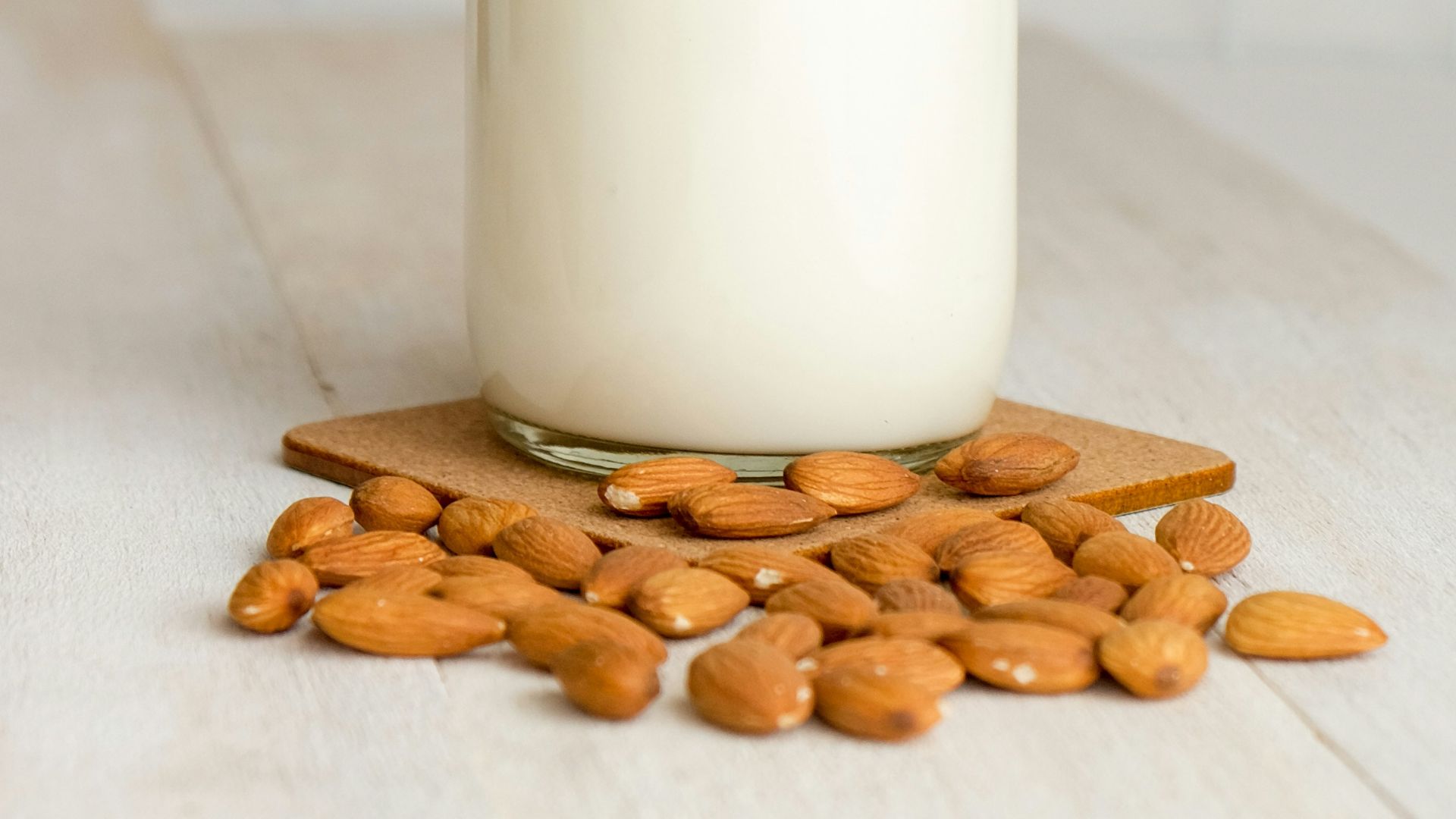 white milk in clear glass bottle