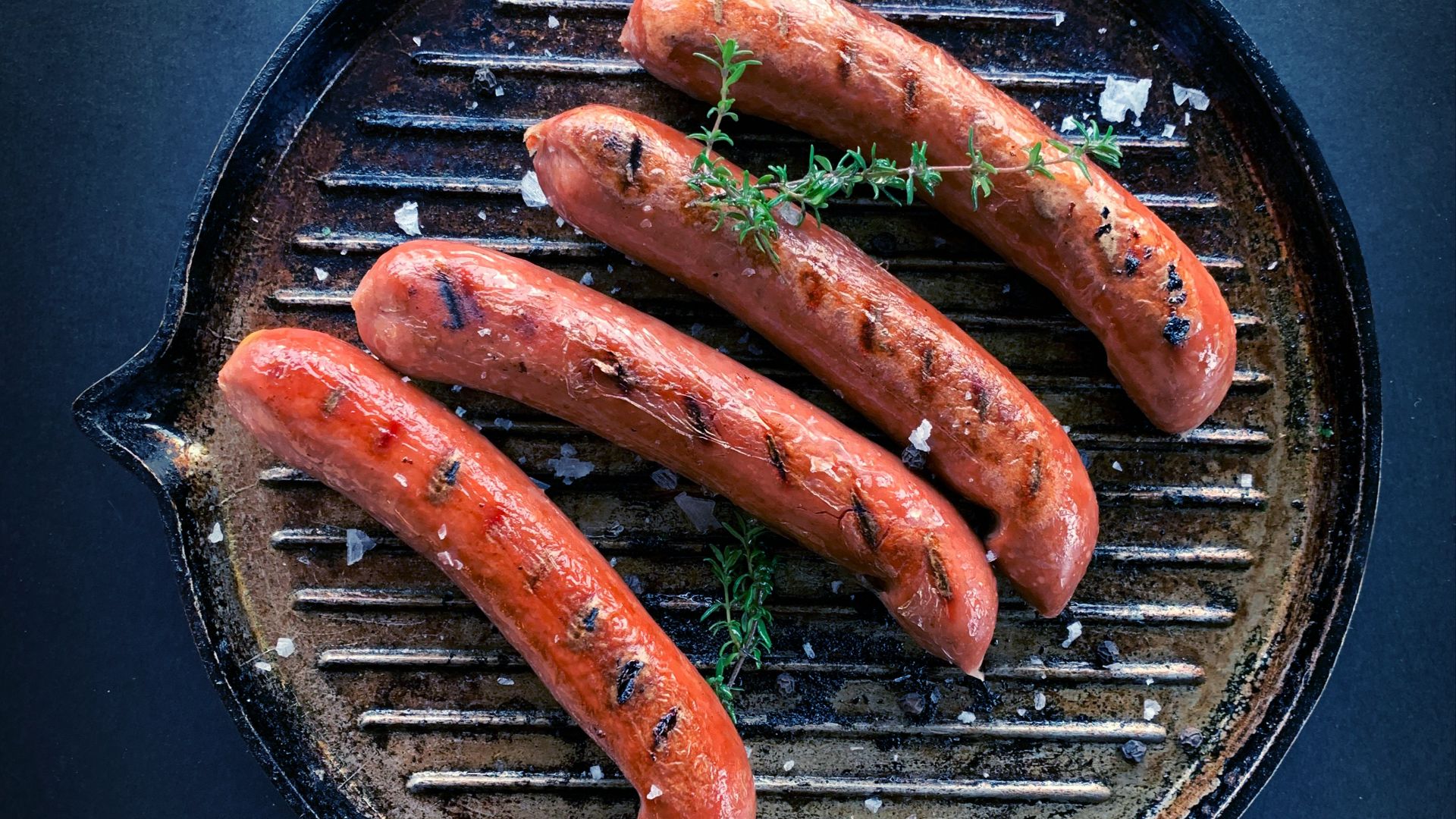 sausage on black round pan