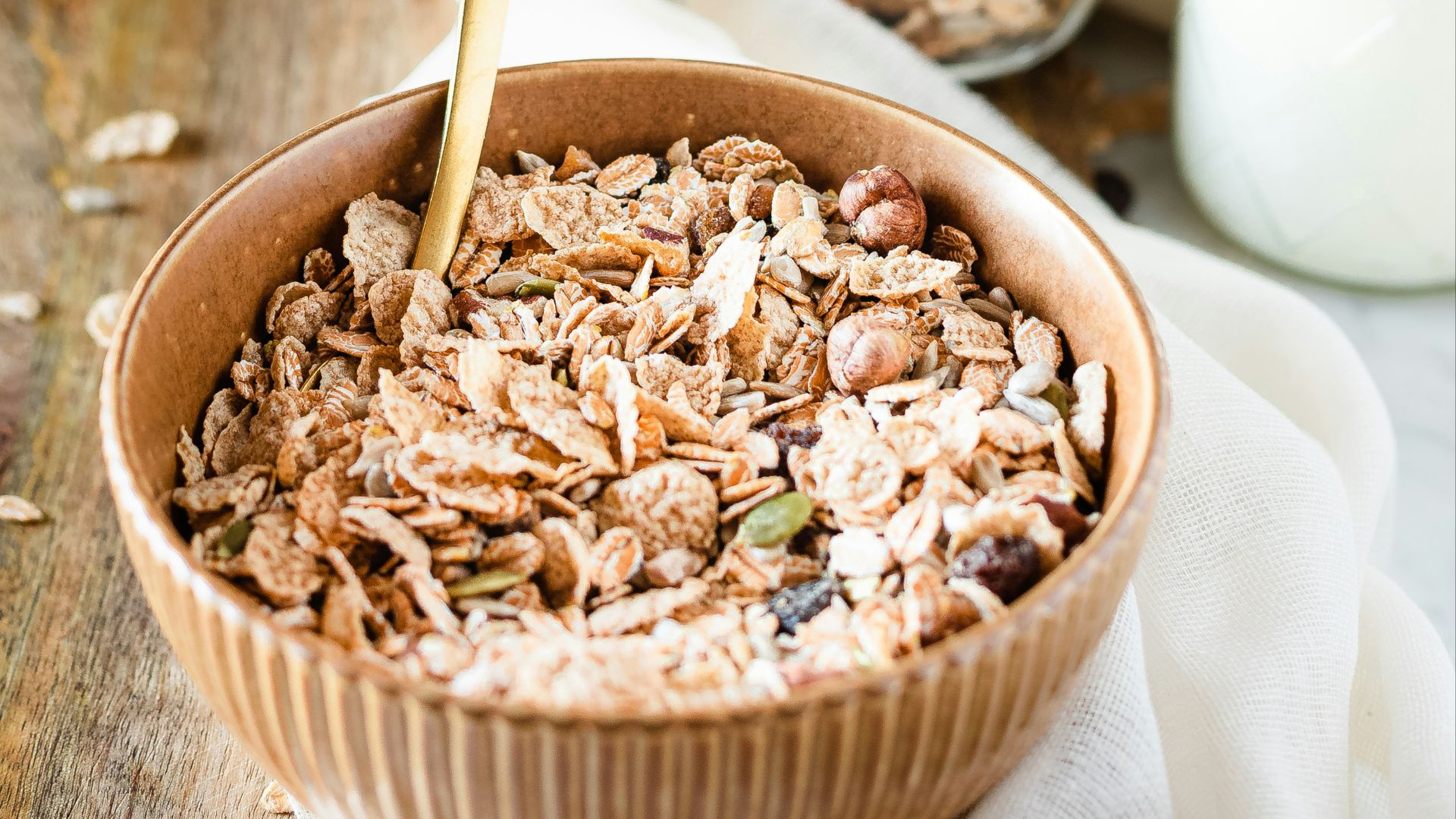 brown wooden bowl with brown wooden spoon