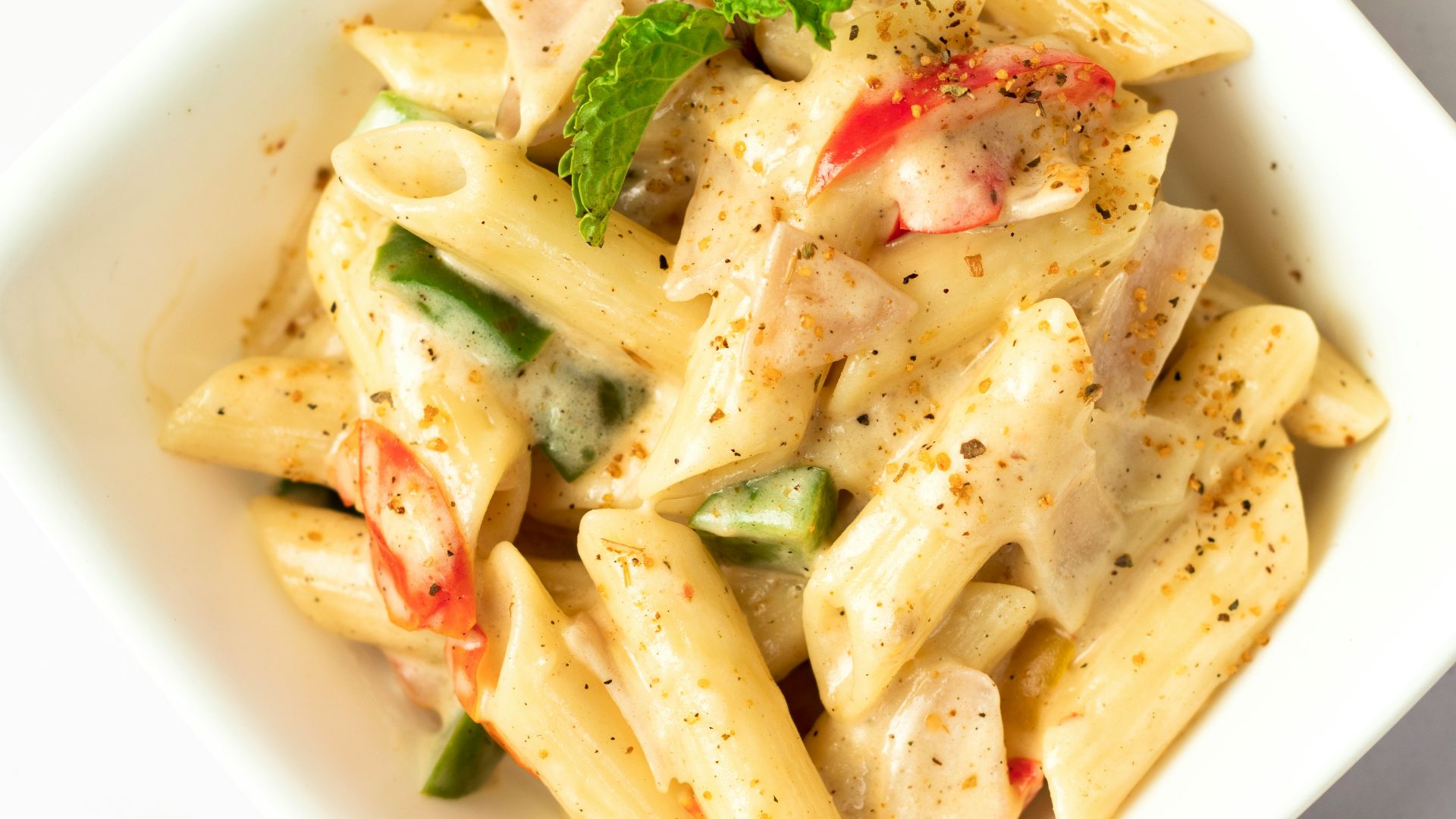 sauced penne pasta dish on bowl