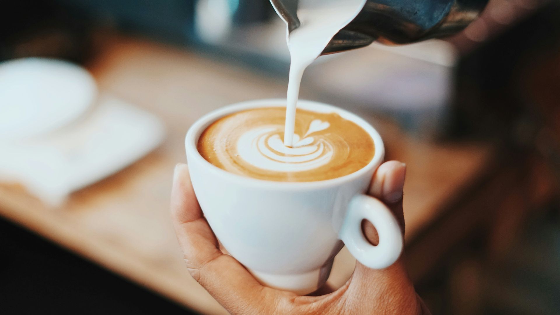 person making latte art