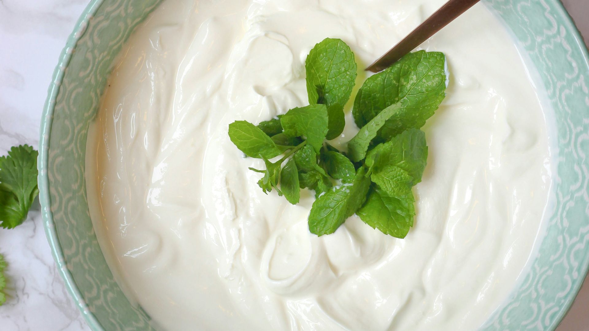 a bowl of yogurt with a spoon in it
