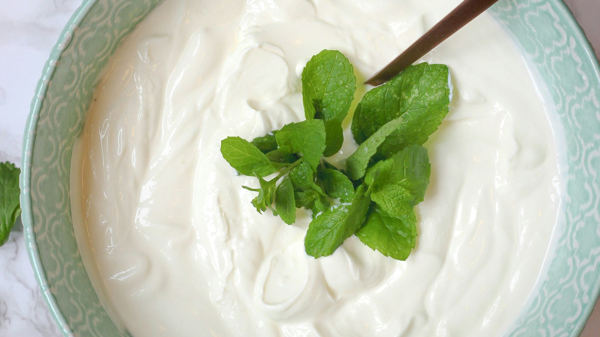 a bowl of yogurt with a spoon in it