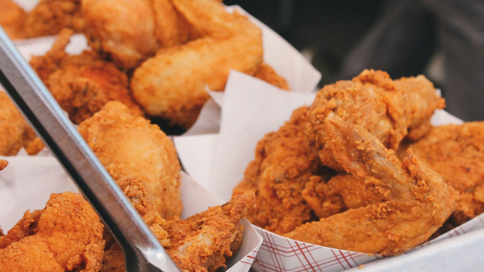 fried chicken on brown paper bag