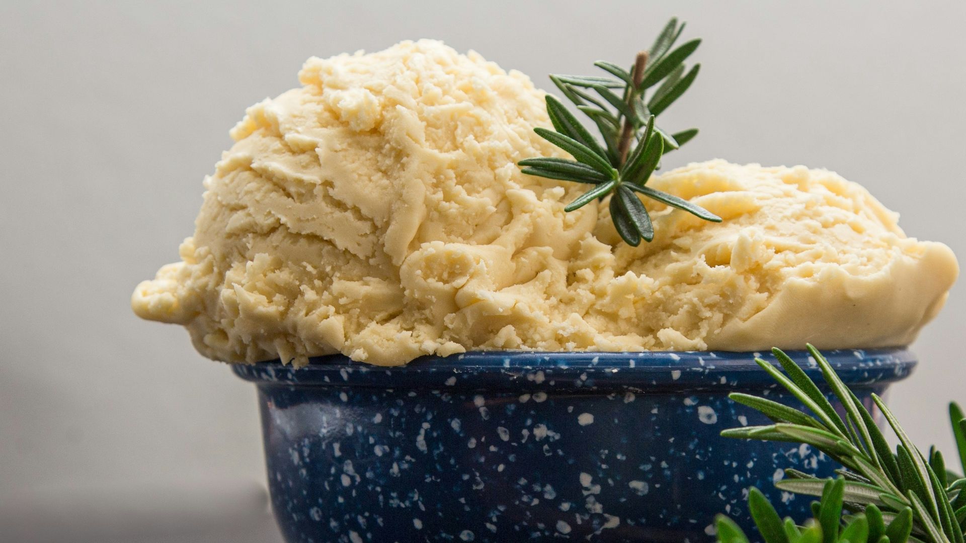 brown wooden spoon on blue ceramic bowl