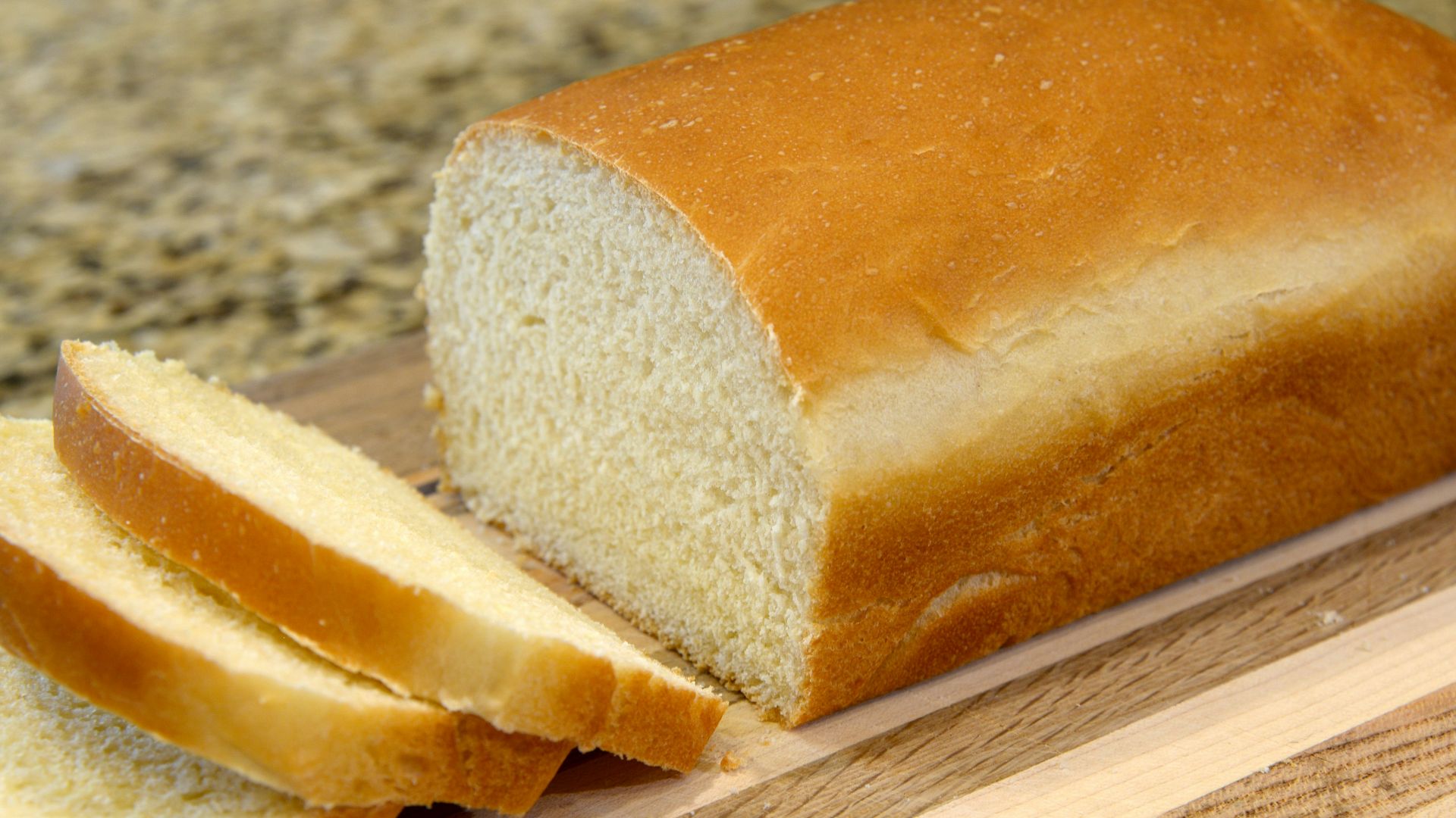 bread on brown wooden chopping board