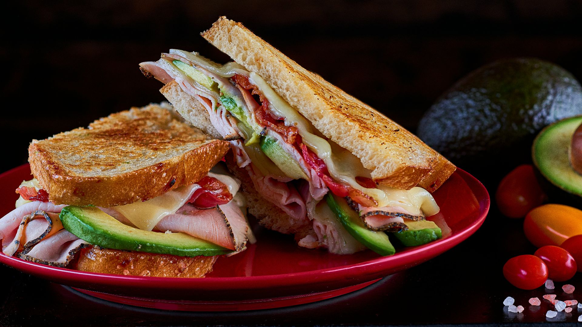 sandwich on red ceramic plate