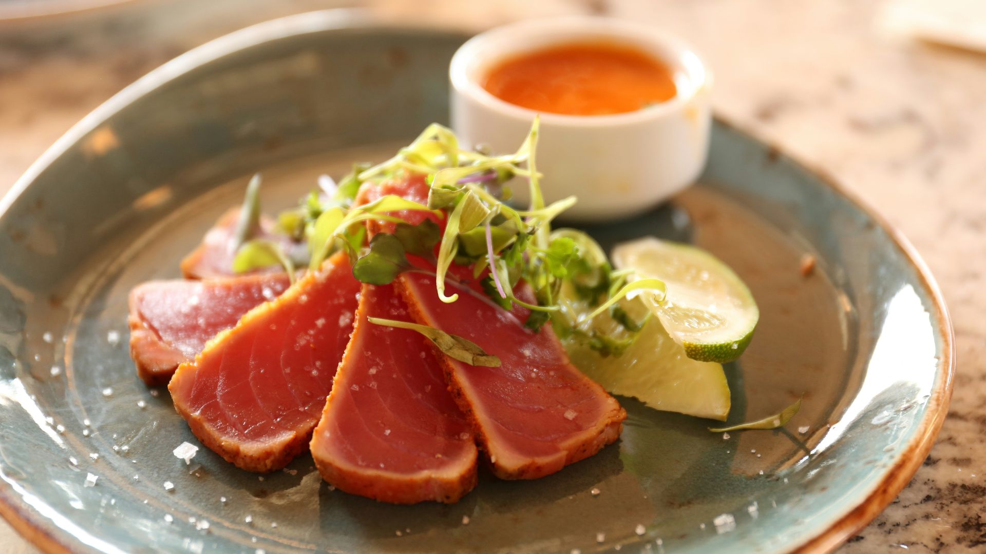 raw meat with spices on green ceramic plate