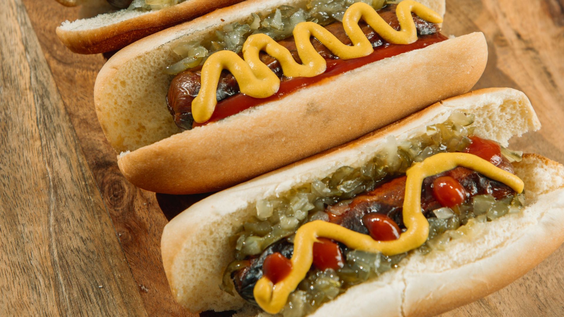 hotdog sandwich on brown wooden table