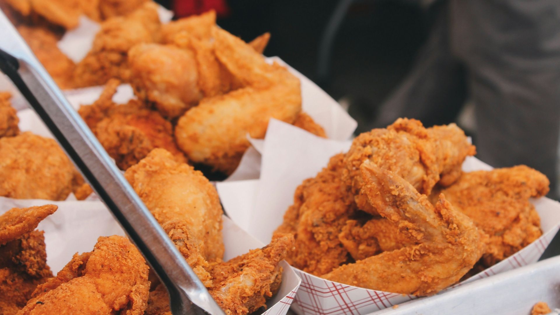 fried chicken on brown paper bag