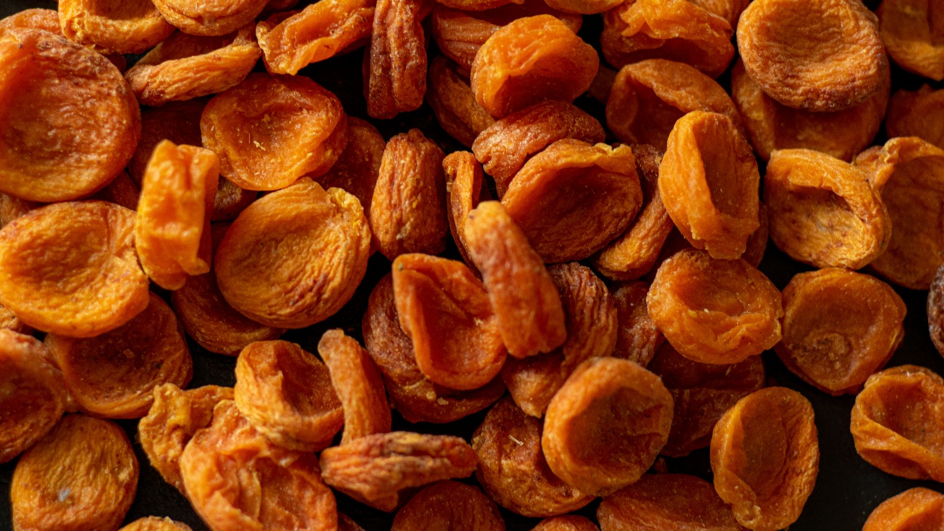 brown almond nuts on brown wooden surface