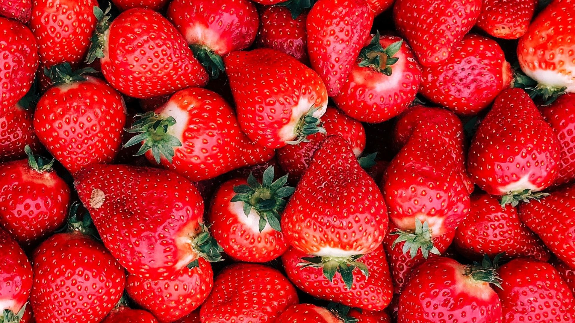 red strawberries on white ceramic plate