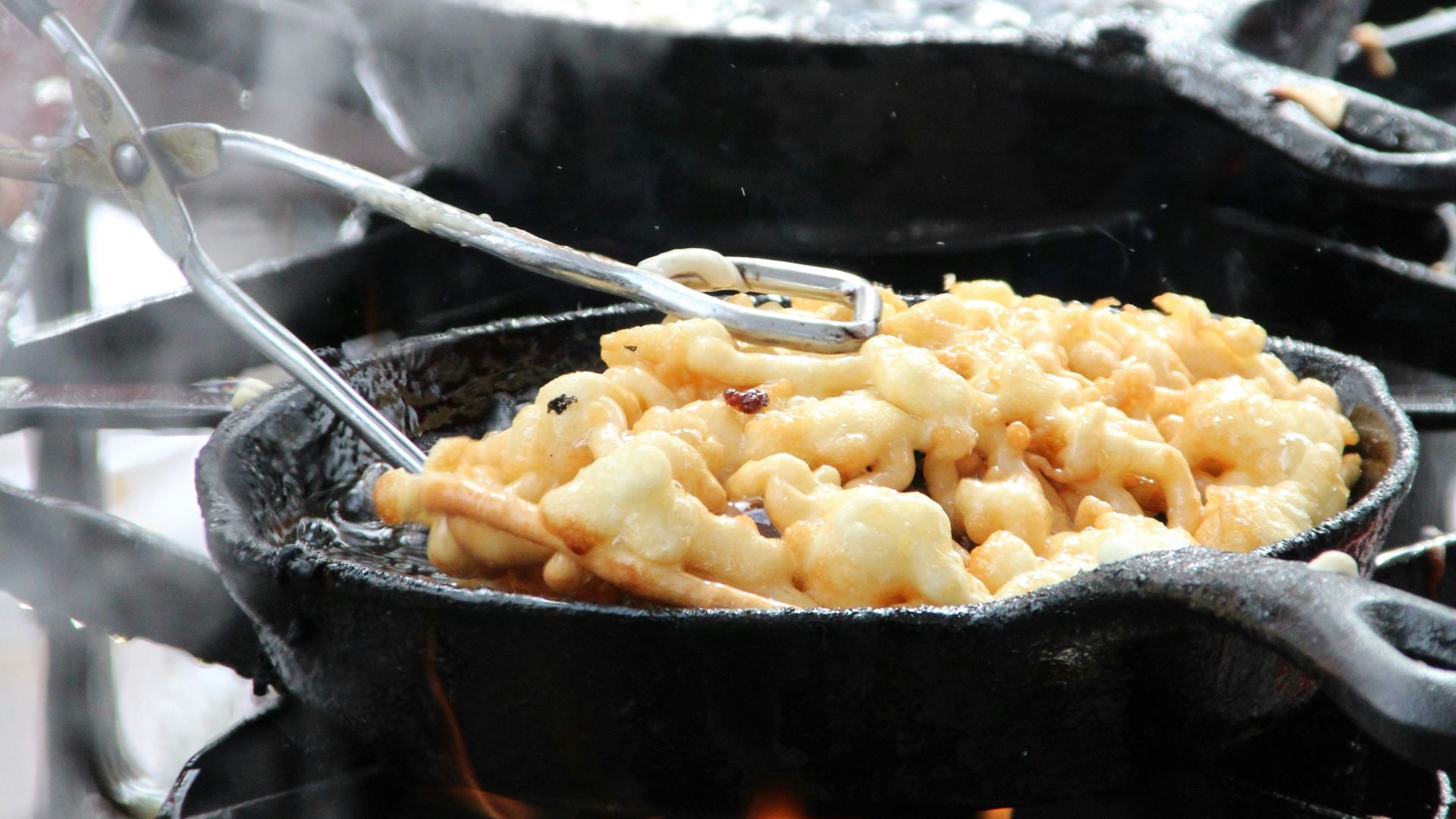 a close up of food cooking on a grill